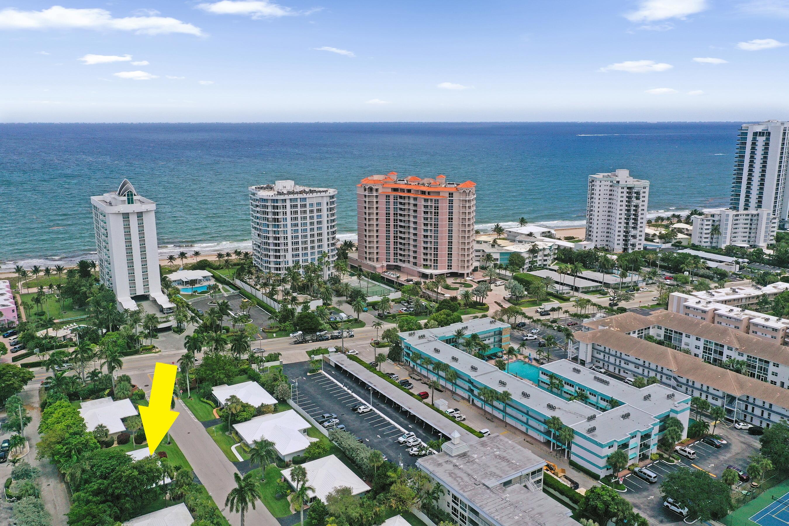 Nothing to do but enjoy! Completely renovated and move-in ready, this exceptional residence blends modern design with effortless South Florida living in a gated enclave between the Intracoastal and the ocean. Villa 2 at Palm Yacht & Beach Club offers bright open-concept living with spacious living and dining areas and a designer kitchen featuring shaker cabinetry, granite countertops, large island with cooktop, textured backsplash, abundant storage, and black stainless appliances. Three bedrooms with custom closets, updated baths, impact windows and doors, interior laundry, two private decks, and one-car garage with electric car charging outlet. Desirable 55+ community with private beach club, heated pool, clubhouse, marina (waitlist), and extensive maintenance program. Two pets allowed.  The maintenance program provides exceptional value, covering homeowners and flood insurance, roofs, exterior painting, landscaping, yard irrigation, pressure cleaning, marina, clubhouse, refuse, full-time staff, and on-site management—allowing owners to enjoy a truly low-maintenance lifestyle. Perfect as a full-time residence or seasonal retreat, and two pets allowed! Ideally located between Lauderdale-by-the-Sea and Pompano Beach, residents are just minutes from beautiful sandy beaches, waterfront dining, shopping, and the iconic Pompano Beach Pier