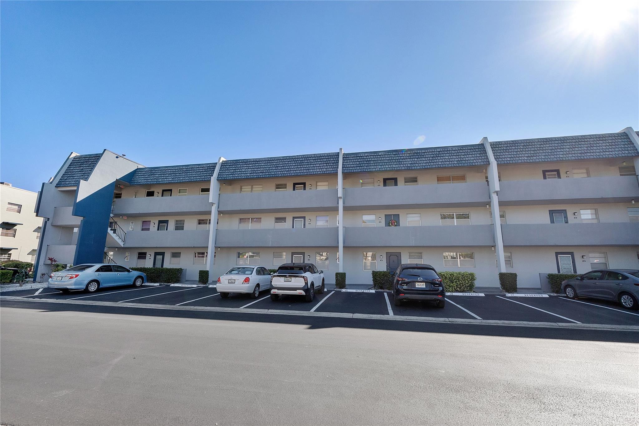 Spacious and beautifully maintained 2-bedroom, 2-bath corner unit on the top floor, offered furnished with golf view. Featuring tile flooring throughout, elegant crown molding and the kitchen and bathrooms have been enhanced by removing the drop ceilings for a more modern look. The A/C was replaced in 2018 and the water heater in 2020.  Located in a well-maintained 55+ community offering great amenities, including a pool, clubhouse, shuffleboard, and more. Monthly fees conveniently include internet, cable, and reserves.