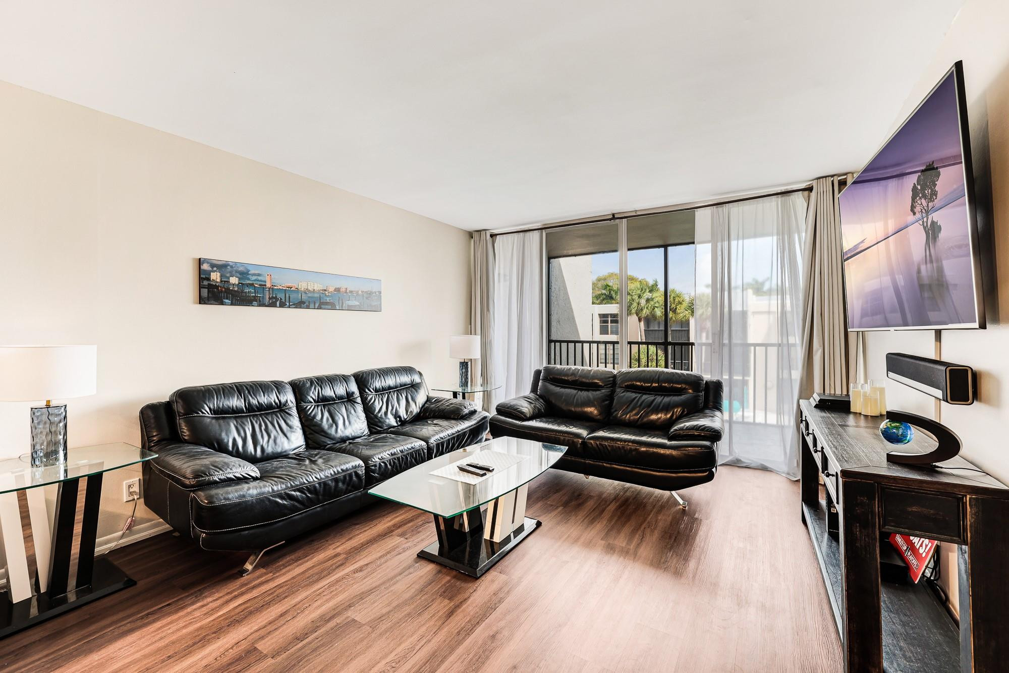 Renovated unit with Brand-New Impact Windows, New A/C, Custom Closets and a Beautiful View view of the Canal with a coastal breeze. Resort-Style Living Community with Five Saltwater Pools, Two Gyms, Dry-Sauna, EV Charging, BBQs, Putting Green, Tennis and Pickleball courts. 24-hour Gated Security. Close to Mizner Park and only 5 minutes away from the Beach. HOA dues include Master HOI, basic cable, water and trash. No trucks allowed.