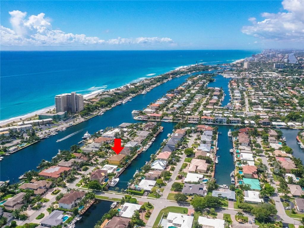 Situated On Intracoastal Drive In Lighthouse Point, 1 Mile To Hillsboro Inlet! True 5 Bedroom With 7 Bathrooms Estate in Most Premier Location In LHP, Over 7,000 Sq Ft With 90ft Of True Deepwater Dockage With Immediate Access To Ocean! Impeccably Maintained Residence by Caring Owners! Impressive Master Suite With Seperate His-Hers Bathrooms, Expansive Sitting Area and Private Waterview Balcony! All Additional Bedroom Are En Suite! Waterside Pool Area With Complete Tiki Bar/Lounge, Ideal for Entertaining and Family Enjoyment! Easy Walk To LHP Yacht Club!