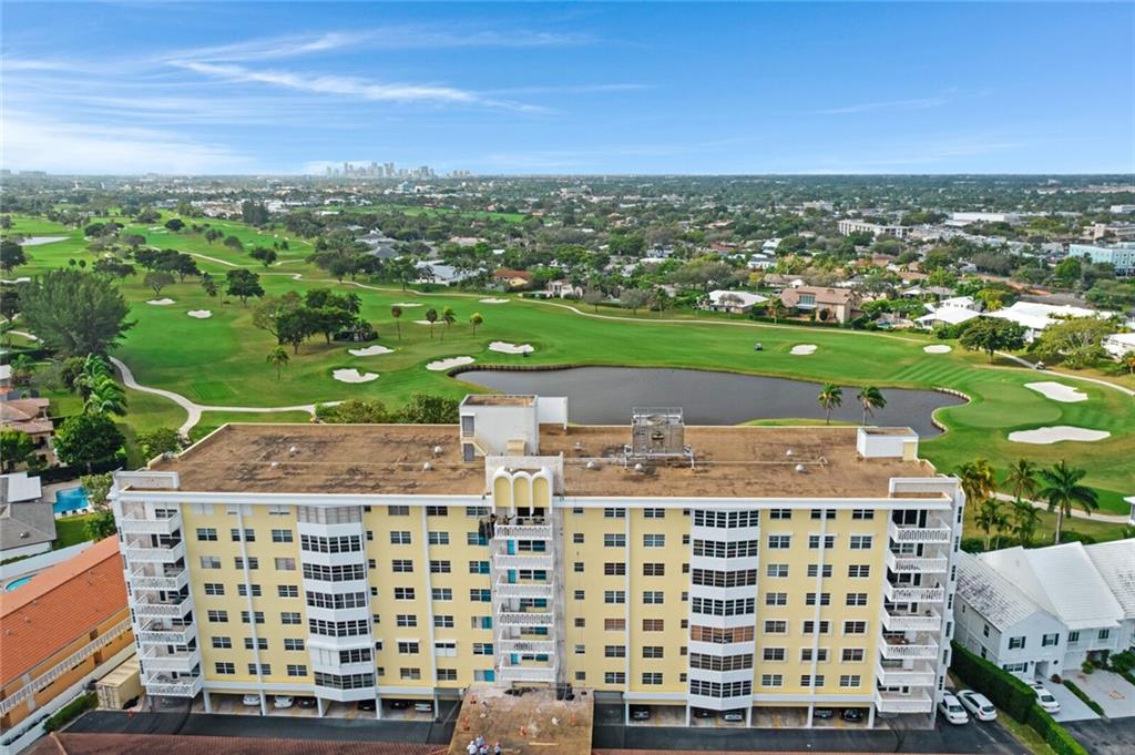 Move right into this remodeled 5th floor unit with views of the Coral Ridge golf course! Open kitchen with breakfast bar, stainless steel appliances and tons of natural light. Wood laminate floors throughout. Impact windows. In unit washer and dryer. Remodeled bathrooms. Plantation shutters. Covered parking space. Excellent east Fort Lauderdale location just a mile to the beaches, shopping, dining, and nightlife in downtown Lauderdale by the Sea.