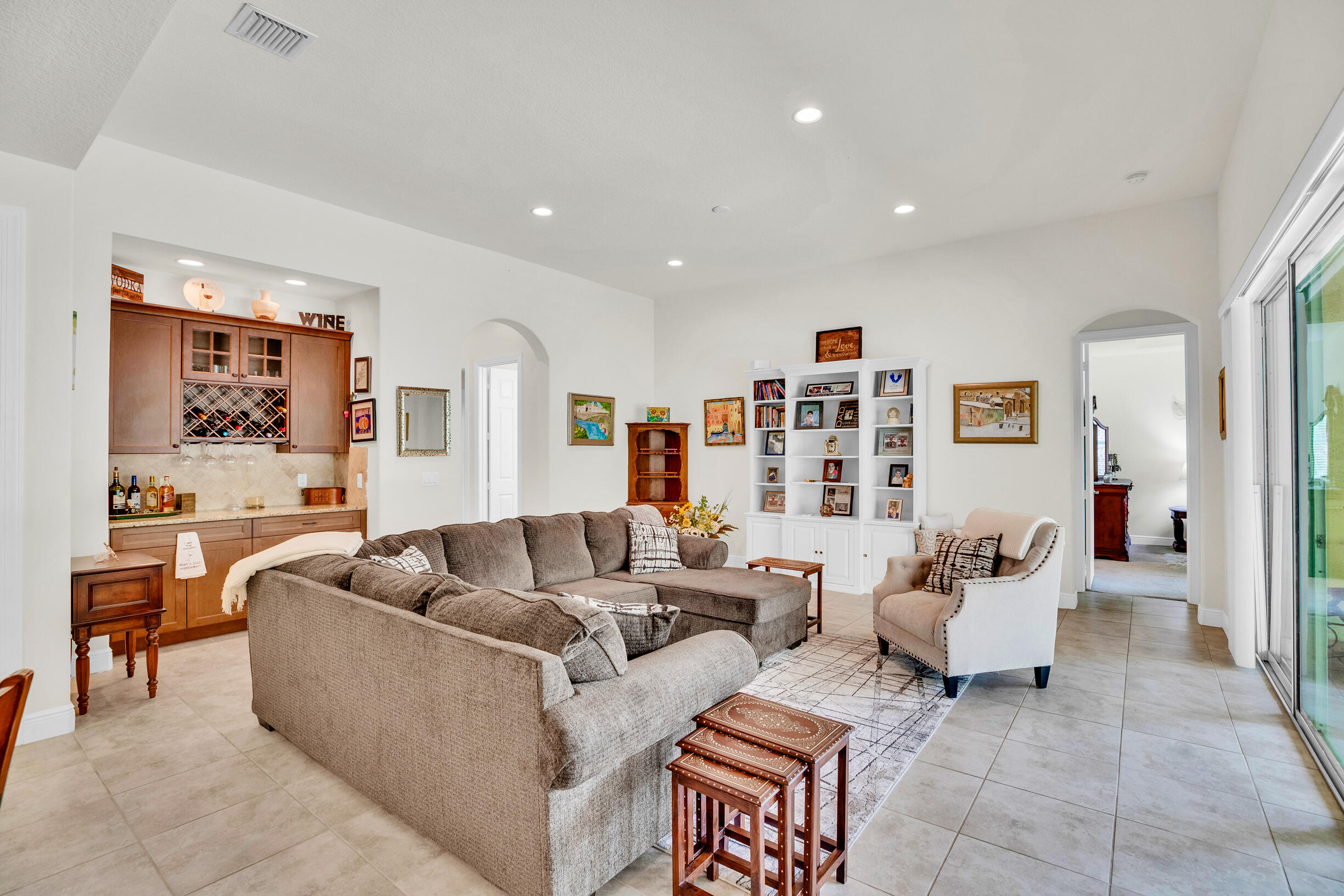 This meticulously maintained 3BR/2.5BA home with an office, is nestled in the community of Serenoa. Built in 2016 (original owner). Home backs up to a nice wooded area for added privacy. The large island kitchen features SS appliances, granite countertops, and a dry bar, while the open living area offers recessed lighting and sliders that open to an expansive patio. The primary suite includes walk-in closets, a spacious bath, and elegant tray ceilings. High 8 ft doorways and a split bedroom layout enhance the home's open, private feel. Residents enjoy a community pool, gym, and security.