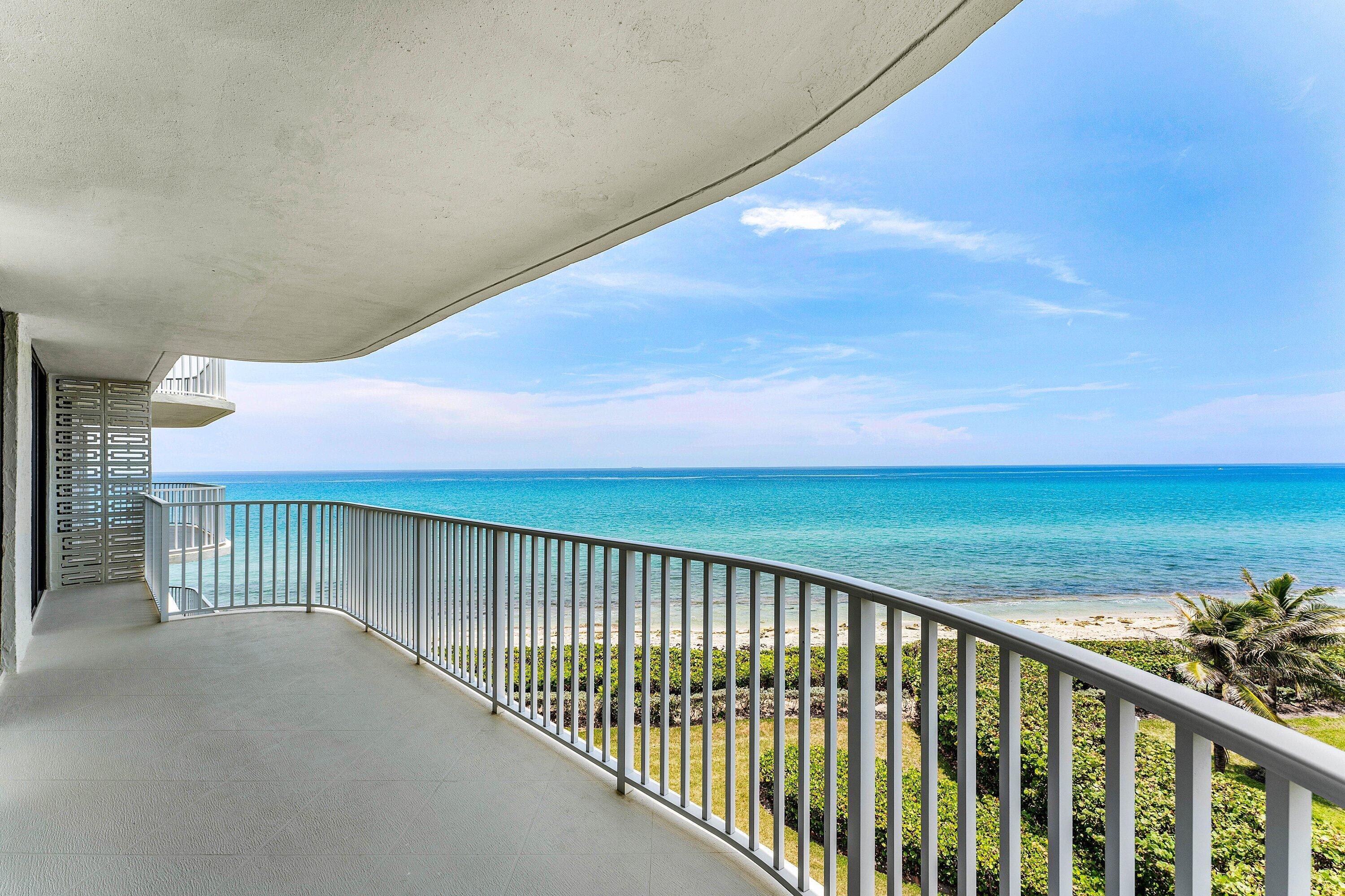 Waterfront home with spectacular, direct views of the Atlantic Ocean and Intracoastal from all main rooms. Spacious, sunny condominium encompasses nearly 2,500 square feet with its 2-wraparound balconies facing east, south and west. This 3-bedroom/2.1-bathroom residence was tastefully renovated and reconfigured to 2-bedrooms with an expanded living space for entertaining with panoramic water views (easily returned to 3-bedrooms). Renovations include a new open kitchen and appliances, luxurious bathrooms, impact glass. The 3360-building provides 24-hour doorman, onsite manager and garage parking. Resort-like amenities include beach access, pool, tennis courts and gym. Close to Par 3 golf. Recently completed concrete restoration assessment paid by the seller.