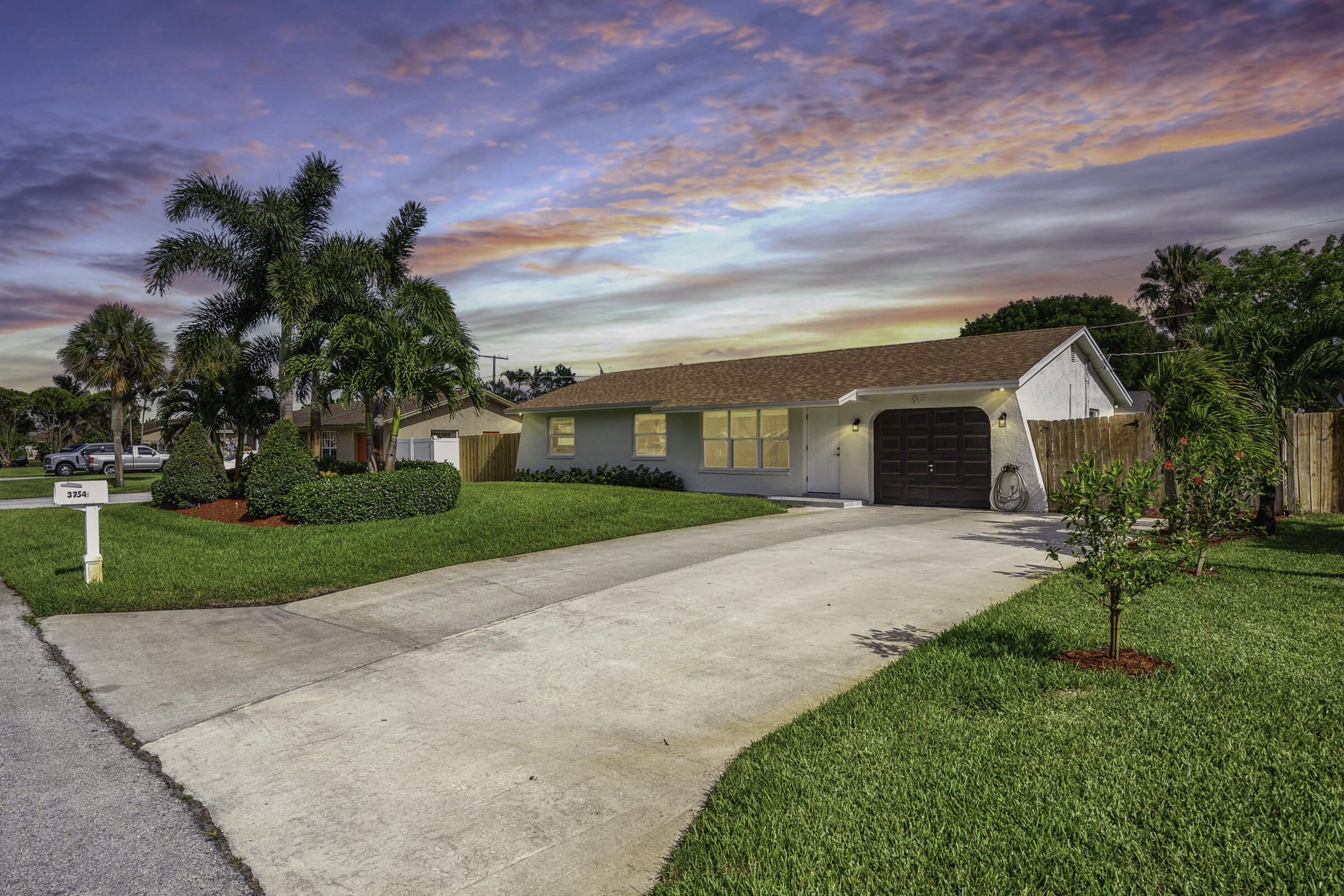 Beautifully renovated 3BR/2BA home situated on a rare double lot with NO HOA in Boynton Beach. Move in ready with impact windows & doors, newer roof (2020), new electrical panel, updated laminate flooring, fresh paint, remodeled bathrooms with walk in showers & a modern kitchen featuring stainless steel appliances. Enjoy Florida living year round from the screened patio overlooking the meticulously maintained landscaping & sprinkler system. The oversized lot offers endless possibilities with room for a pool, boat, RV or future expansion. Conveniently located near shopping, dining, parks, schools & major highways. A perfect blend of style, comfort & functionality with upgrades throughout. Professionally landscaped, exceptionally maintained & ready for its next owner. Simply move in & enjoy!