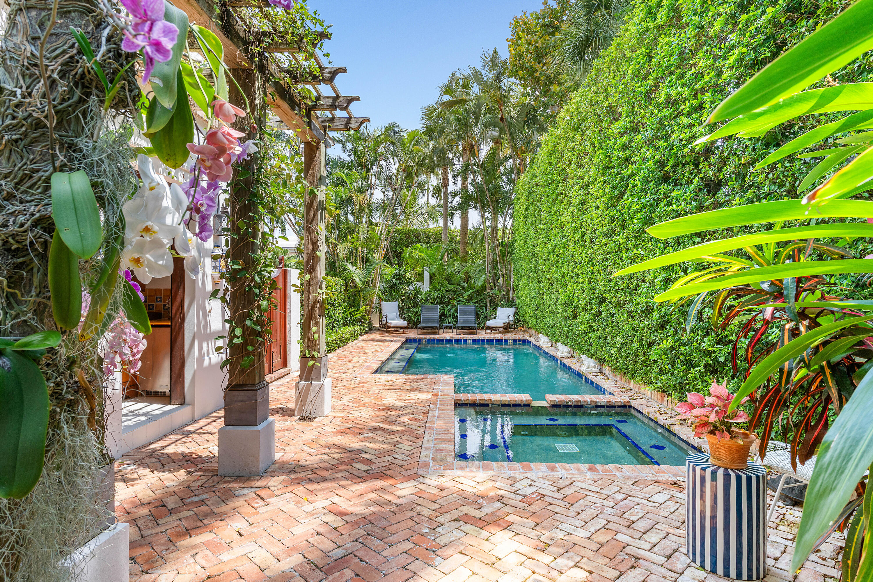 Villa Del Paraiso, a completely renovated 4 bedroom/5.5 bath residence showcasing Old World architecture integrated with today's finest interior finishes and premier products. This conveniently located in-town home features symmetry and proportion. An abundance of natural light from the many windows throughout captures the lovely manicured garden views and pool/spa. Several inviting gathering areas inside and out  unveil the quiet and beautiful ambiance of the home. An old world new Parisians style elevator, 2 fireplaces, attached guest quarters, den, attached garage, full house generator complete the extremely well thought out sophisticated and charming renovation.