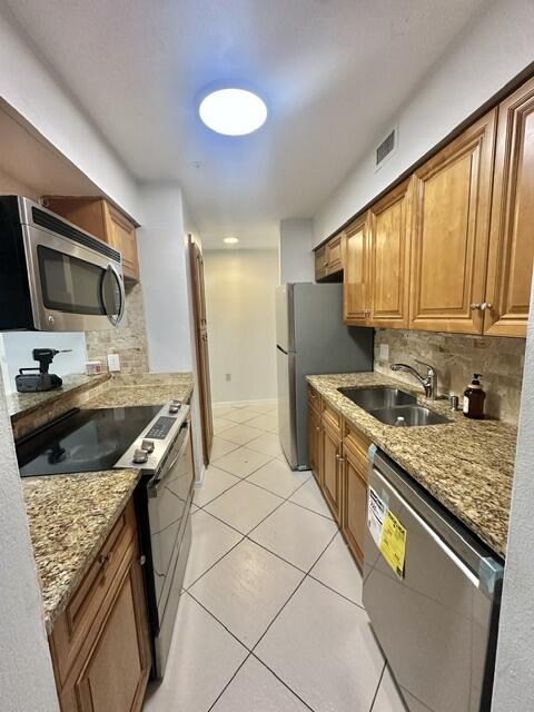 Welcome to your light and bright 3-bedroom, 2-bathroom corner unit. Situated on the first floor, this home features an updated kitchen complete with  granite countertops and newer stainless-steel appliances. The open-concept living area and one bedroom has tile, while the other two bedrooms offer warm, wood-look flooring. Both bathrooms have been fully modernized. For ultimate peace of mind and energy efficiency, the home is equipped with impact-resistant windows and doors. New Hot water heater and AC is a couple of years. Step out to the screened patio to enjoy a magnificent, unobstructed view—the perfect spot to unwind and relax. Amenities include clubhouse,  pool, Tennis, gym, indoor basketball court,party room. Lease  up to 3x a year, 30 day minimum. Close to shopping and restaurants.