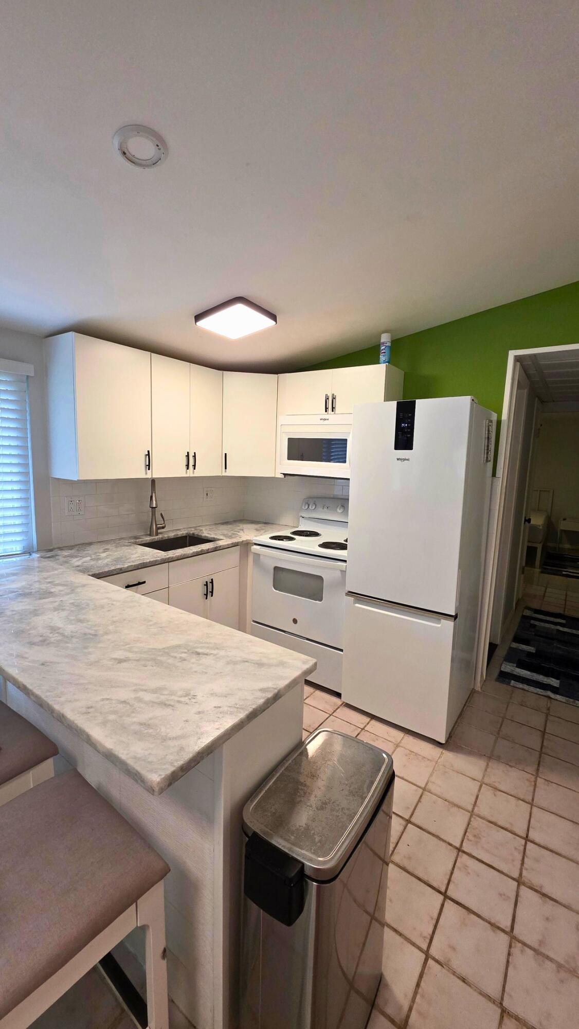 Move right into this spacious and private 1-bedroom, 1-bath residence with the convenience of dedicated driveway parking. This partially furnished home features an updated kitchen and bathroom, easy-to-maintain tile flooring throughout, and a private side yard complete with a deck, perfect for grilling or relaxing.  Enjoy the simplicity of one all-inclusive monthly payment that includes water, electricity, and Wi-Fi. Just bring your toothbrush and settle in. Conveniently located near shopping, dining, major roadways, and everything you need, this rental offers comfort, privacy, and exceptional value.  Private owner - NO HOA!