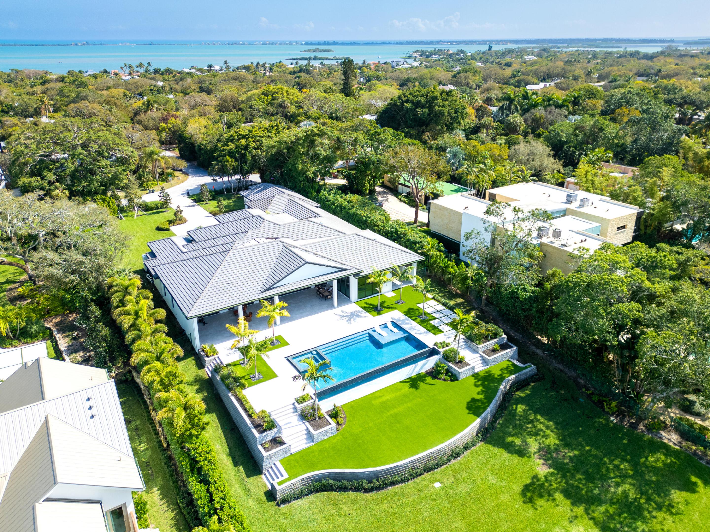 Introducing ''Villa Acquabella'', The Pinnacle of Waterfront Luxury. Situated on almost 1 and a quarter acre, this estate features 127 feet of deep water frontage and is 36 feet ABOVE Sea Level!

Be the first to own the newest and first new construction waterfront home in the exclusive Sewall's Point, Barrier Island. Designed by the esteemed Arthur Rutenberg Homes, this architectural masterpiece offers 5,391 square feet under air and an expansive 8,479 total square feet, seamlessly blending coastal elegance with modern sophistication.

A Home Designed for Luxury & Entertaining! Floor-to-ceiling windows frame breathtaking water views, while soaring ceilings, custom millwork, and designer finishes elevate the home's grandeur. Whether hosting intimate gatherings or lavish soirées, this home is built to impress!

This home is made for the Ultimate Entertainer as it has dual kitchens! 

Luxury Gourmet Chef's Kitchen - Outfitted with top-tier appliances, bespoke cabinetry, and an oversized island for culinary excellence.

Dedicated Entertaining Kitchen - A second, fully equipped space designed for seamless hosting and effortless meal preparation.

Elegant Primary Suite - A private sanctuary with serene water views, a spa-inspired bath, and custom walk-in closets.

Expansive Living & Dining Spaces - Designed for both comfort and grandeur, with seamless indoor-outdoor flow.

Palm Beach Resort-Style Outdoor Oasis - A sprawling lanai, and infinity-edge pool, all overlooking the tranquil water.

Private Dock - Direct access to deep water, perfect for boating enthusiasts.

An Unmatched Waterfront Location on the West side of Sewall's Point, known for it's water, estate lots and privacy!

This rare offering allows quick access to the Intracoastal and Atlantic Ocean, while being just minutes from fine dining, boutique shopping, and top-rated schools.

Sewall's Point is located just north of Palm Beach and is know as the sister island to Jupiter Island. Sewall's Point is its own barrier island located between the St. Lucie and Indian River Lagoon in Martin County, FL.  Voted Coastal Living's Happiest Seaside Town, it is a nationally recognized Tree City and an Audubon Society Certified Bird Sanctuary. We are passionate about our wildlife and trees and take great care to protect them. Here lies a unique opportunity to own a property in one of the most desirable locations in all of Sewall's. The town of Sewall's Point has its own police station, building department, waterfront park and more!  Enjoy meeting your neighbors through daily walks along River Road, Book Clubs and now the Sewalls Point Social Club! Live, Love Sewall's Point!