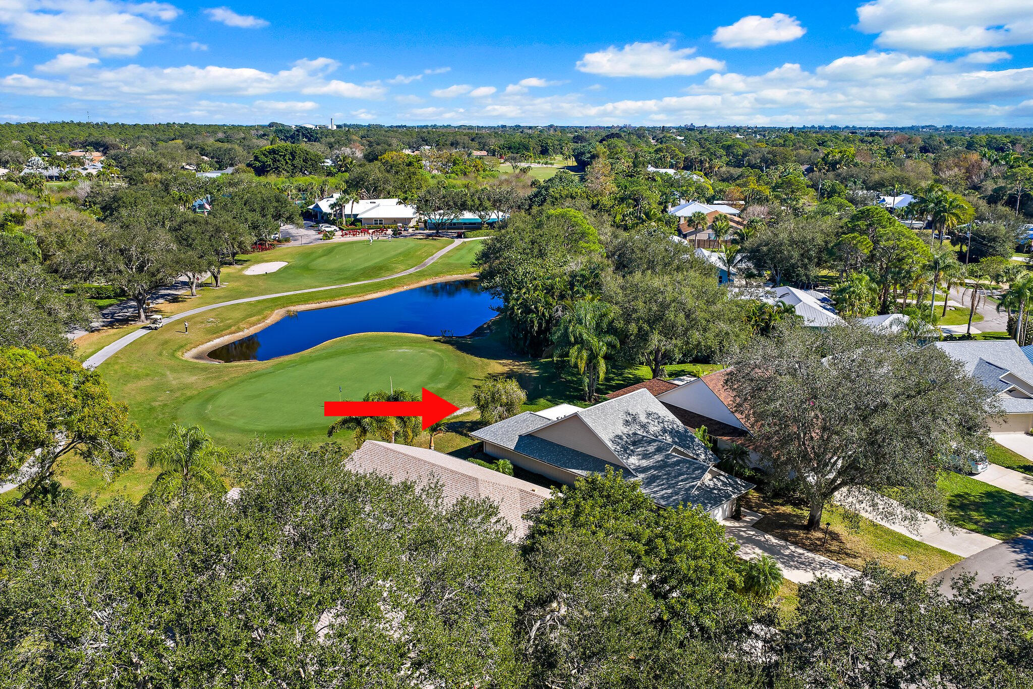 Perfectly positioned along the fairway and just a short walk to the clubhouse, this well-maintained 2-bedroom, 2-bath single-family home offers an exceptional opportunity to enjoy the sought-after lifestyle of Eaglewood, one of Hobe Sound's premier 55+ golf communities. Combining peaceful golf course views, major system updates, and the chance to personalize the interior over time, this home is the perfect blend of comfort, value, and location. Designed with peace of mind in mind, the home features a new roof (2023), hot water heater (2024), HVAC system (2018), plus a combination of impact glass and accordion shutters for added storm protection. Wake each morning to tranquil fairway views from the primary suite, or relax with your morning coffee or evening cocktail in the spacious  272-square-foot enclosed patio. HVAC ductwork has already been extended into this space, offering the flexibility to enjoy it year-round as additional air-conditioned living space, a hobby room, home office, or cozy Florida room.  Inside, the functional floor plan is filled with natural light and offers generous living spaces ready to enjoy today while providing the perfect opportunity to add your own personal style over time. The kitchen features warm light oak cabinetry, stainless-steel appliances, ample storage, and an efficient layout that flows seamlessly into the main living areas, making everyday living and entertaining both comfortable and convenient.  Beyond the home, Eaglewood offers a truly exceptional lifestyle with unlimited golf included on its beautifully maintained 18-hole executive golf course, along with a putting green, golf pro shop, heated pool and spa, tennis and bocce courts, dog park, covered outdoor grilling areas, and an inviting clubhouse featuring a commercial kitchen and an active calendar of social events, tournaments, and community gatherings. On-site management and maintenance provide added convenience, allowing residents to spend more time enjoying everything this vibrant community has to offer.  Ideally located just minutes from Hobe Sound's pristine beaches, waterfront dining, shopping, and everyday conveniences, this is an outstanding opportunity to own a golf course home in one of the area's most welcoming and active communities.