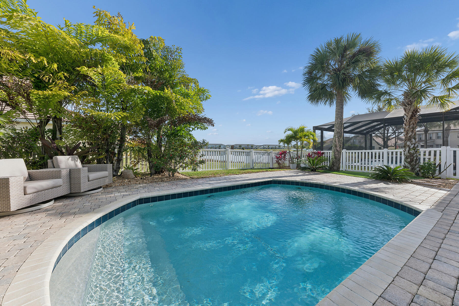 Welcome to this beautifully updated lakefront estate residence with 3,165sqft total located in the gated Victoria Parc Estates in the heart of desirable Traditions and walking distance to Traditions Square. This spacious home offers 3 bedrooms, 2 and a half bathrooms, a first floor den or playroom and an expansive upstairs flex space ideal for a second living area, 4th Bedroom, home office, gym, or media room. Enjoy a serene long lake view from your private backyard oasis, complete with a saltwater pool, tropical landscaping, and plenty of space for outdoor entertaining or quiet relaxation. Inside, the home features a bright, open floor plan with modern finishes, the extended kitchen has white cabinets, white quartz countertops, SS appliances and wood-like tile through out the living area  Victoria Parc residents enjoy access to walkable parks and trails, nearby shopping and dining, and a vibrant calendar of community events. Experience the unmatched lifestyle that Tradition living offers.