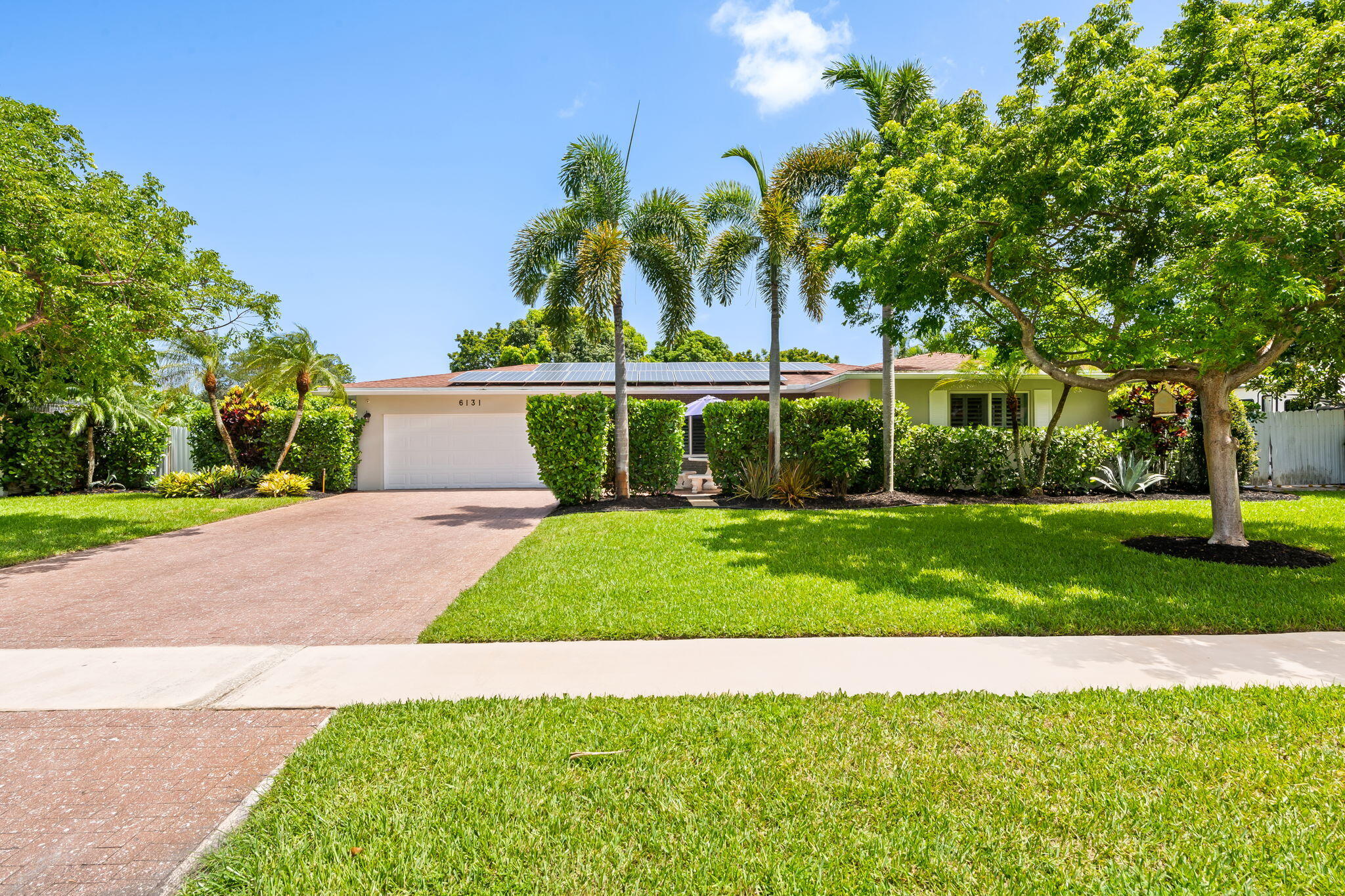 Don't miss out on this lovingly updated ranch style home in tree-loving Plantation! Schools are nearby as well as a dog park and large public parks. This home features a roof from 2020 and impact windows and doors. The plumbing has been update with a 50 year warranty and sellers purchased solar panel system resulting in very low electric bills. Brand new AC and duct work. Extra attic insulation. Large outdoor shed, huge travertine patio and rv/boat area on side of house. Fruit trees, updated kitchen, flooring as well as many built in cabinets throughout. 2 car garage has been converted to air conditioned laundry and living space. Back patio has been enclosed into a Florida room. Plenty of room for a pool if wanted. Not far from FLL  and close to shops/dining. Call for an appointment! This property could fit an addition if more rooms desired.