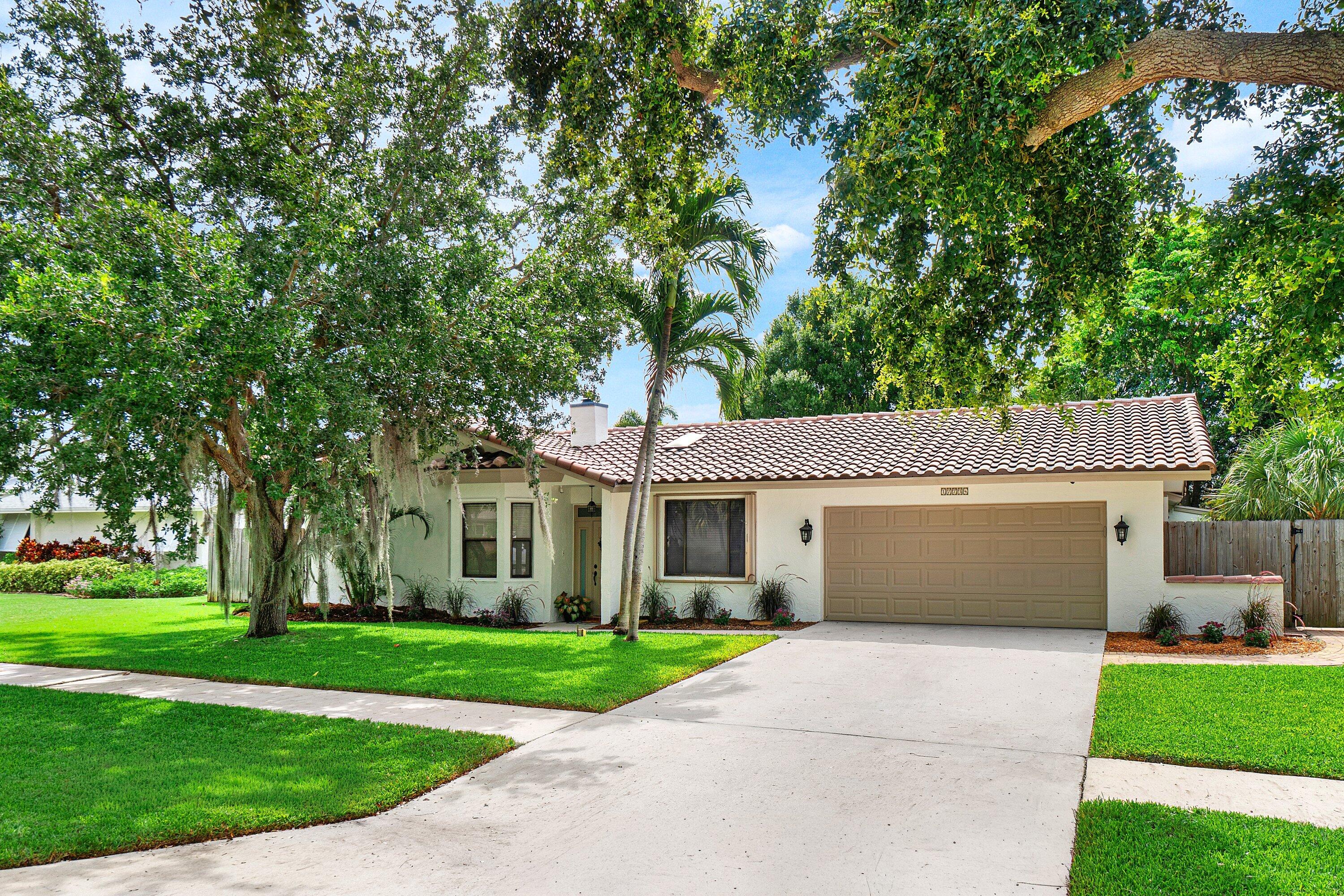 Spacious 4-bed, 3-bath pool home located in sought-after Pheasant Walk community in Boca Raton on one of the most desirable streets steps away from the community park. Abundant natural light fills the home through numerous windows and skylights. This well-designed split-bedroom floor plan offers a private primary suite separate from the additional bedrooms, along with multiple living spaces including a family room, living room, and cozy sitting area featuring a wood-burning fireplace.  Enjoy FL living in the fenced backyard with a screened patio, large pool with waterfall, and plenty of green space for play and entertaining. Fresh exterior paint, beautiful curb appeal, and a well maintained lawn complete the package. Ideally located near major highways, shopping, dining and A-rated schools