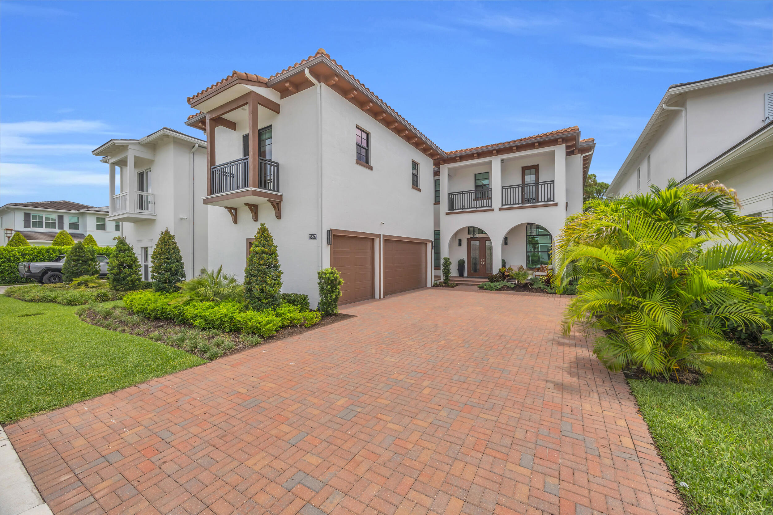 Welcome to 13372 Bernoulli Way, a beautifully upgraded 5 bedroom, 5.5 bath residence that boasts an open spacious floor plan, office, upstairs loft, casita, laundry rooms on both floors, custom pool, spa, and preserve views in the highly sought-after Alton neighborhood of Palm Beach Gardens. This light and bright Modern Mediterranean home has soaring ceilings, upgraded lighting, designer fans, custom millwork, elegant built-ins, and seamless indoor-outdoor living.   The chef's kitchen features GE Monogram appliances, a 36" artisan wood hood, upgraded cabinetry, oversized island, wine fridge in the butler's pantry, and refined finishes throughout, including custom wood paneling, large upstairs loft, and a casita ideal for guests, extended family, or added privacy. The owner's suite includes a shiplap ceiling treatment, luxury wall covering, drapery, two walk in closets, spa-inspired bath with a freestanding soaking tub, Moen U digital spa package, dual vanities, and outdoor balcony.  Owner upgrades include water filtration and softening throughout, UV and Reme Halo air purification systems, custom ceiling details, built-in cabinetry in the great room and mudroom, upgraded interior and exterior lighting, remote-controlled blinds, and a security system with camera coverage and remote access.   Outside, enjoy a custom A&G pool and spa, summer kitchen, and covered lanai with a private preserve backdrop. Located minutes from Alton Town Center, beaches, golf, dining, shopping, and major roadways, this lightly lived-in home offers newer construction, extensive upgrades, and one of Palm Beach Gardens' most desirable family lifestyles.