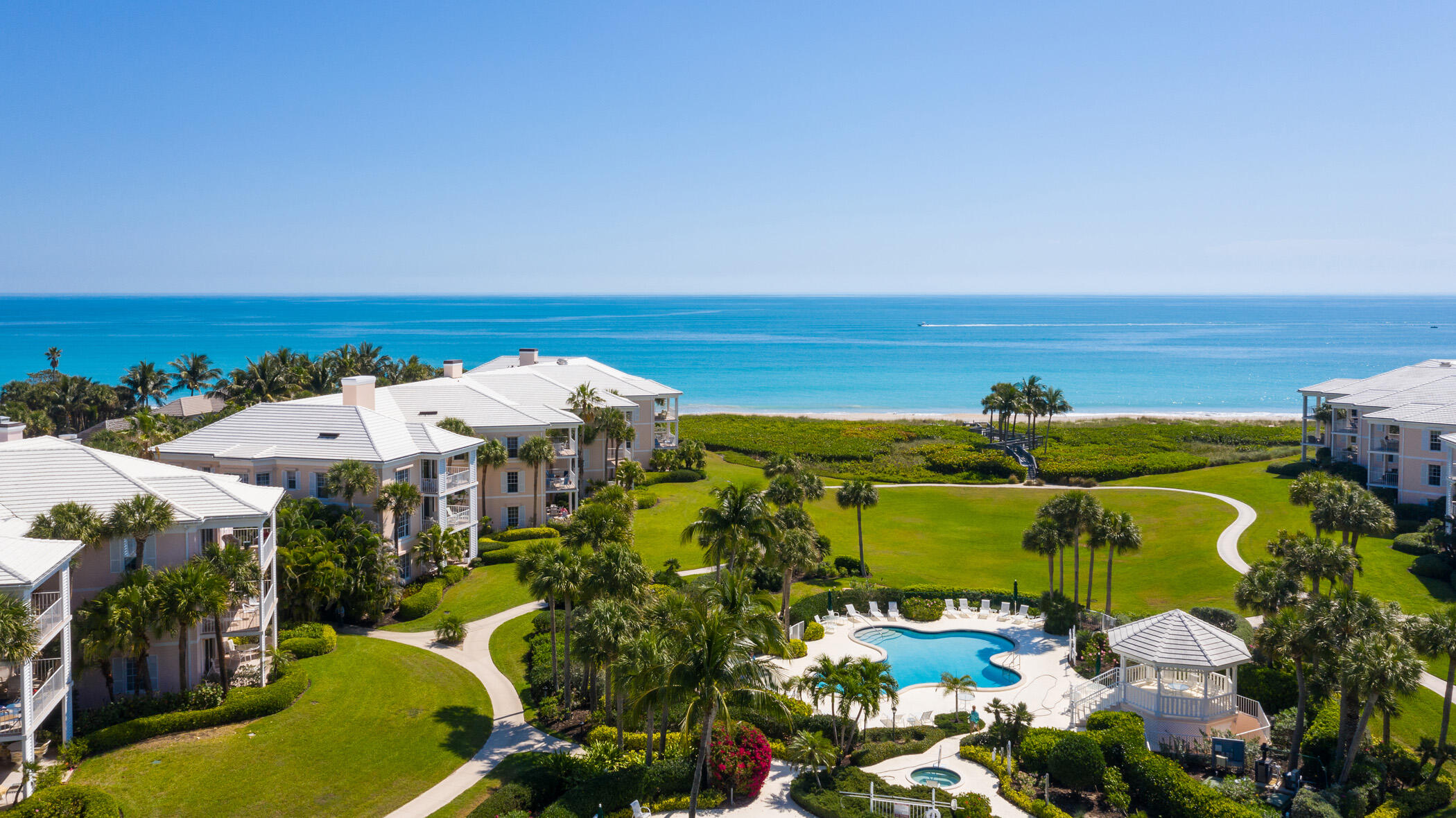 If you are considering a simpler lifestyle but don't want to give up space, this oceanfront condo is for you. Offering over 3,000sqft with 3-storage closets (one air-conditioned) and 2 side-by-side garage parking spaces. elegantly styled first floor residence, beautifully updated and lives like a house. walk directly to the beach and pools from the unit. Featuring new wood flooring, Impact Glass doors and Windows, Plus electric shutters, New paint, spacious cooks kitchen, Den/library renovated bathrooms,Plantation shutters, wet-bar and beautifully maintained grounds with two pools and a spa. Gated Community.