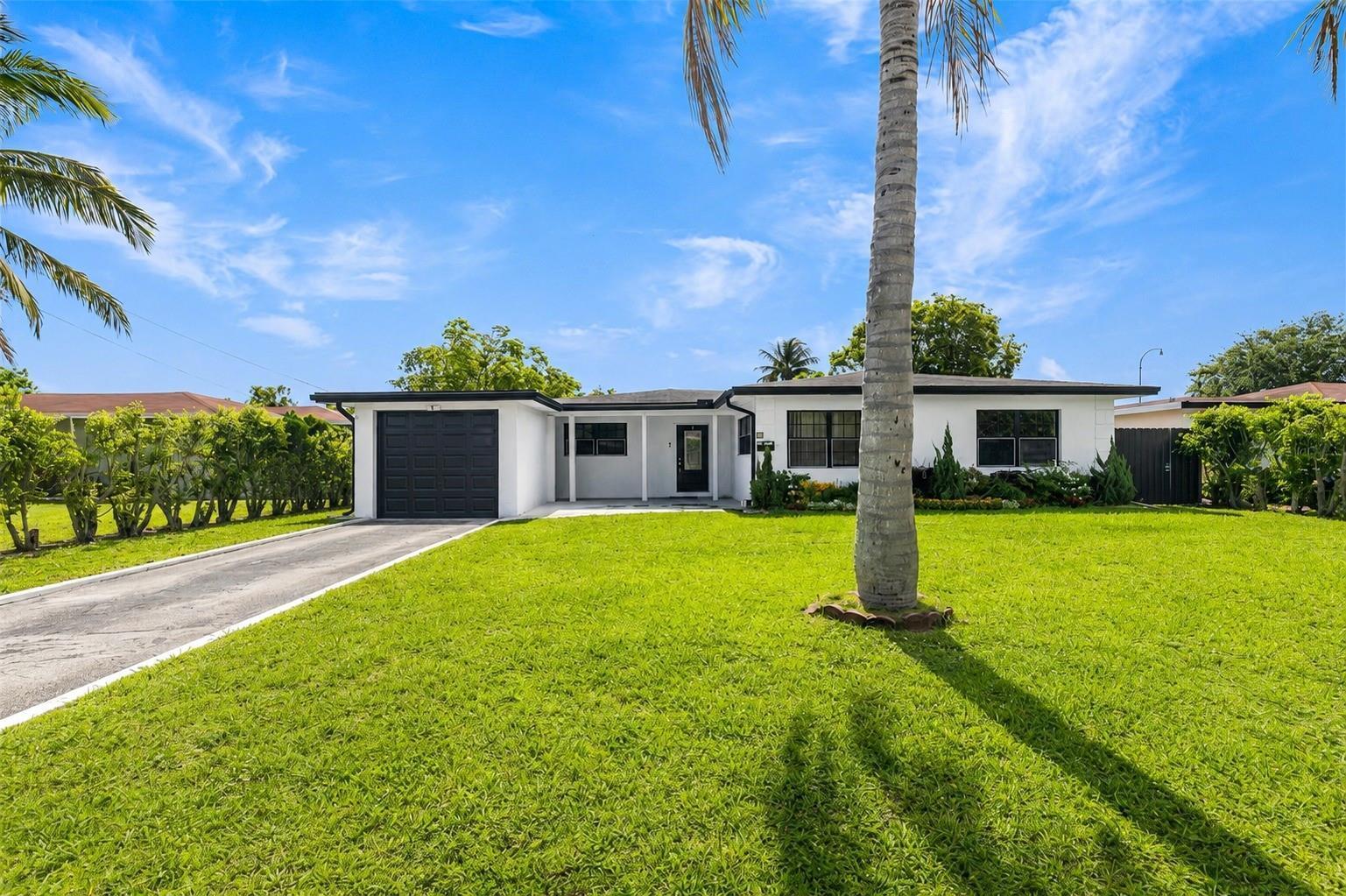 Discover the charm of Plantation living at 24 NW 42nd Terrace, where comfort, space and Florida living come together in one exceptional home. Situated on an oversized lot in a well-established neighborhood, this beautifully maintained residence offers the perfect setting for making memories, entertaining guests, and enjoying everyday life. From the moment you step inside, you'll appreciate the abundance of natural light, spacious living areas, and inviting layout designed to accommodate both quiet evenings at home and lively gatherings with family and friends. The heart of this home provides a seamless connection between the living spaces, creating an atmosphere that feels warm, open, and welcoming. Outside, the expansive backyard offers endless opportunities to create your dream outdoor o