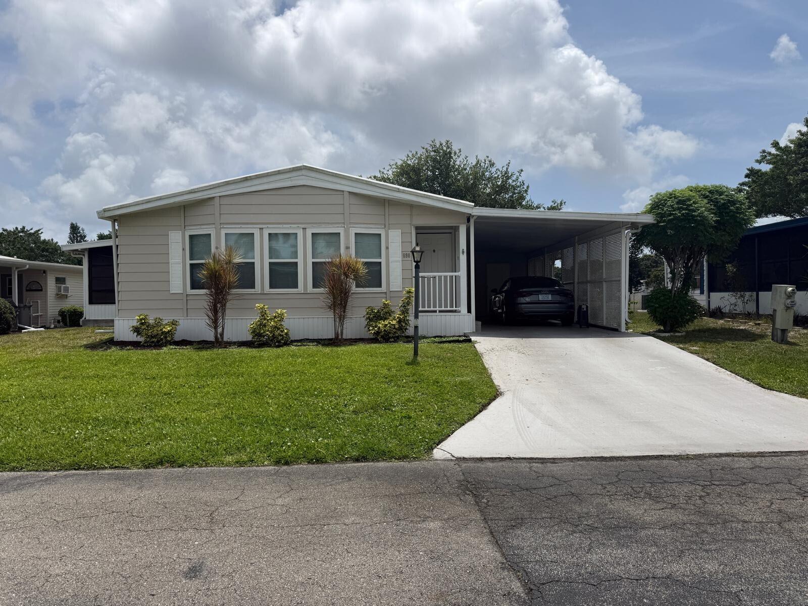 Stunning remodel in Sunny South Estates, 55+ Community, 2BR/2BA., move-in ready. Enjoy a modern lifestyle, bathrooms with modern finishes, the convenience of indoor laundry. This is a rare opportunity to own a home that truly has it all! It has a large patio for outdoor activities. Enjoy the beautiful view of the lake and natural lighting along with the community amenities. All measurements are approximate. This property is available for purchase with Financing or Cash.  Call the listing agent today to schedule your private tour.