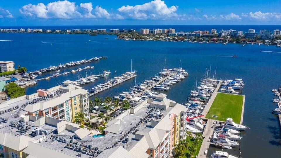 Enjoy breathtaking intracoastal, marina, and Lantana Bridge views from this serene 3BR/2BA furnished southeast corner condo. A spacious covered balcony off the living room captures stunning east-facing water vistas, while the primary suite offers its own private balcony with sweeping southern views. Immaculate and beautifully maintained, the open kitchen and living areas offer comfortable, light filled spaces with water views from all major rooms, including the primary bath. Porcelain tile flooring throughout. Seller is installing new impact glass sliding doors in the living room. Two covered parking spaces add convenience. Furniture is included. The Moorings delivers a resort style lifestyle with two pools, an updated club room, gym, café, valet, and 24 hour security.