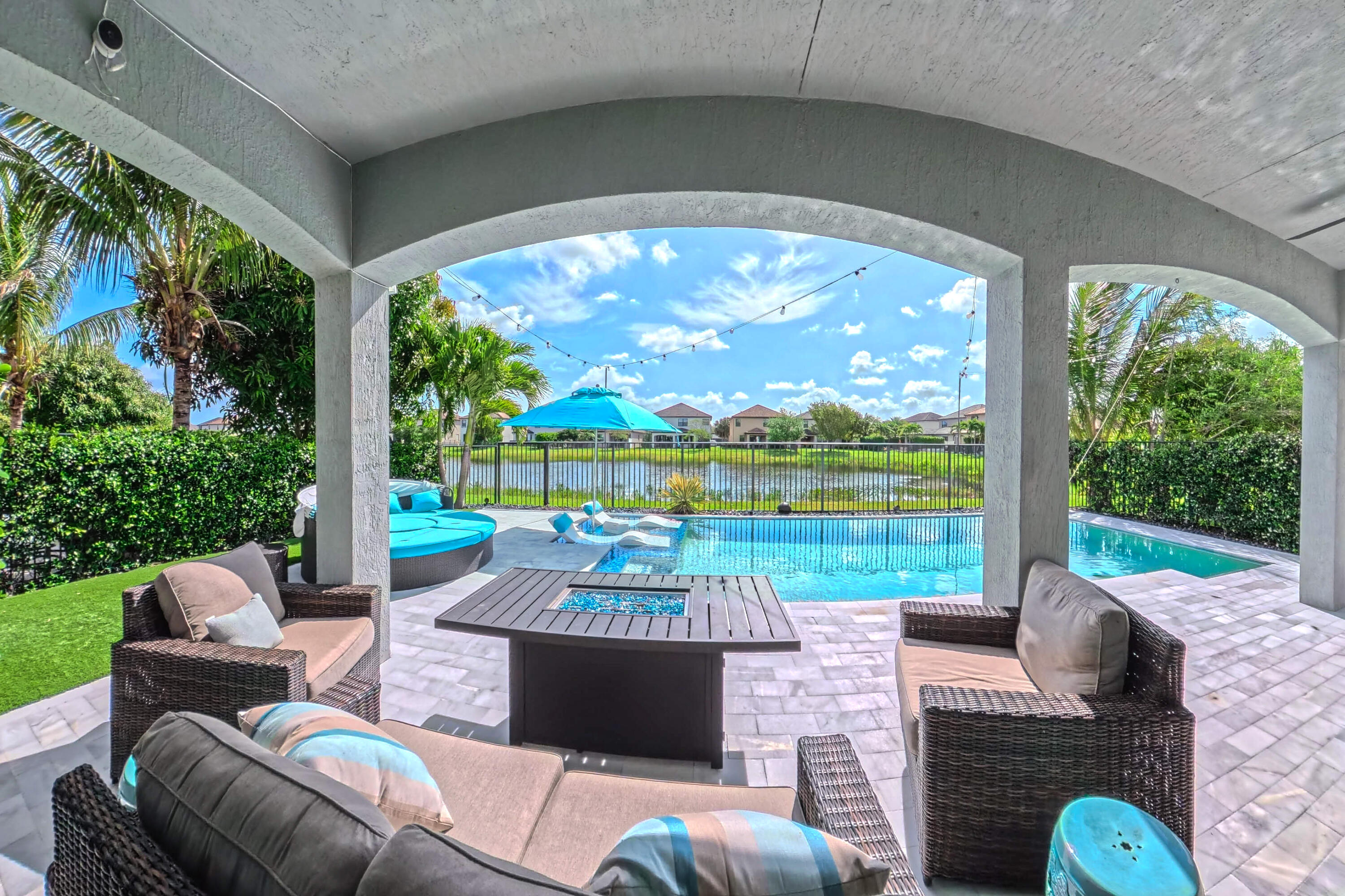Stunning 4-bedroom, 4-bathroom home featuring high-end upgrades and a spacious open floor plan perfect for entertaining. Enjoy luxury vinyl plank (LVP) flooring throughout, LED lighting, crown molding, and custom plantation shutters.The kitchen boasts a gourmet stainless steel range featuring a double oven. The home offers custom closet shelving with automatic lighting in walk-in closets, bathrooms, and the laundry room, along with beautifully updated glass showers in every bathroom. Additional highlights include a Tesla charger and custom garage shelving, a low-maintenance backyard with premium artificial turf, and HOA-maintained lawn and common areas. Relax in your private outdoor oasis with a heated/chilled pool highlighted by its water features, travertine tile deck, sunshelf with  lounge chairs, easy to maintain salt-chlorination system, and a Sonos outdoor speaker system wired underground. An upgraded security system with cameras and Ring doorbell provides added peace of mind. All bedrooms feature walk-in closets, and the home is perfectly positioned to capture serene lake views. Located in the quite gated community of Silverwood Estates which boasts of many green spaces, parks, community pool and playground.  Close to top schools, shopping, and entertainment.
