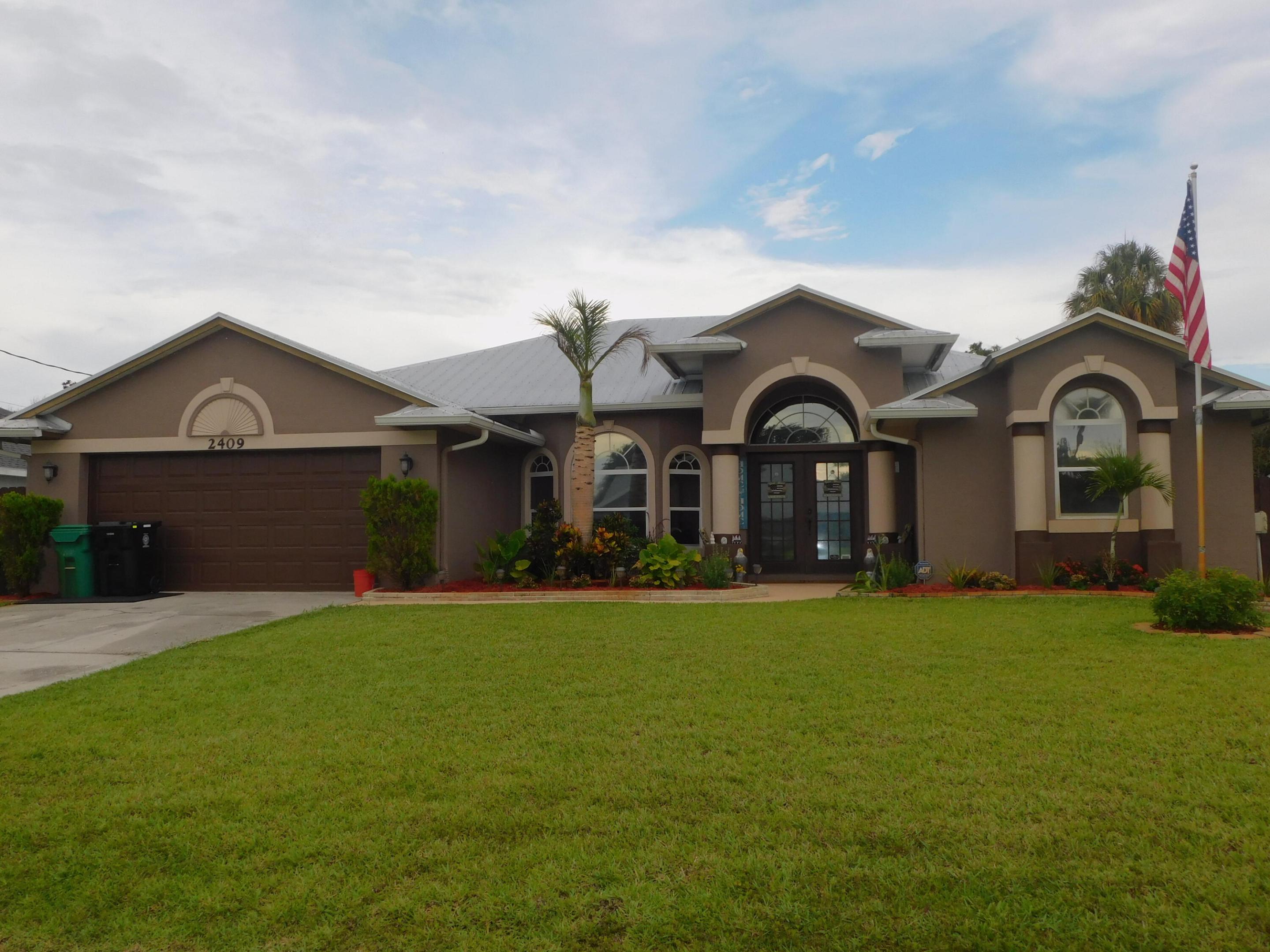 This beautifully maintained home is truly move-in ready, featuring numerous upgrades throughout. Recent improvements include a metal roof in 2019, water heater in 2018, updated master bathroom in 2020, guest bathroom in 2024, fresh exterior paint, all complemented by an elegantly manicured lawn that enhances its curb appeal. Step inside to discover a spacious open floor plan with soaring cathedral ceilings that create a bright and airy atmosphere. The home offers comfortable living spaces designed for both relaxation and entertainment. Enjoy Florida living at its finest on the screened porch overlooking a large, fully fenced backyard enhanced with a charming pergola, providing the perfect setting for gatherings. Every detail reflects meticulous care and pride of ownership.