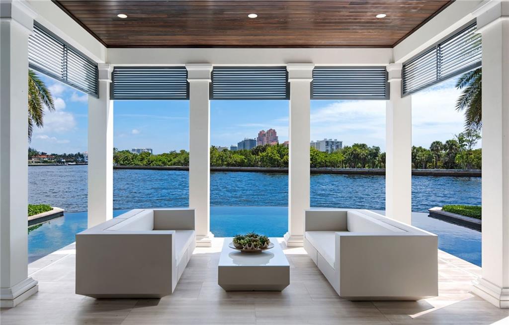 Direct Intracoastal Home has Panoramas of Birch State Park. 2016 Completion Custom Build by W.A. Bentz Construction. Architect George Storrs. Caribbean Design with Marble & Porcelain Floors, Transom Windows, Light & Neutral Interiors, Attractive Moldings, Tray Ceilings. Baths: Onyx & Marble. 11.5 Ft Ceilings, Elevator, Generator, Impact Glass, Privacy Gate, Four Bay Garage. 1st Level Master Suite: Water View, Sitting Room, Two Large Closets. Master Bath: Onyx Tops, Soaking Spa Tub, Two Water Closets. Living Area: Marble Floors, Wet Bar, Fireplace, Sub-Zero Wine Storage, Coffered Ceiling. Marble & Glass Staircase. Kitchen by Florense (Dkota Center) has Caesarstone Tops & Wolf Gas Range. 128 Ft Direct Intracoastal. 133 Ft Side Canal. Dock for Large Yacht. Control 4 Smart House.