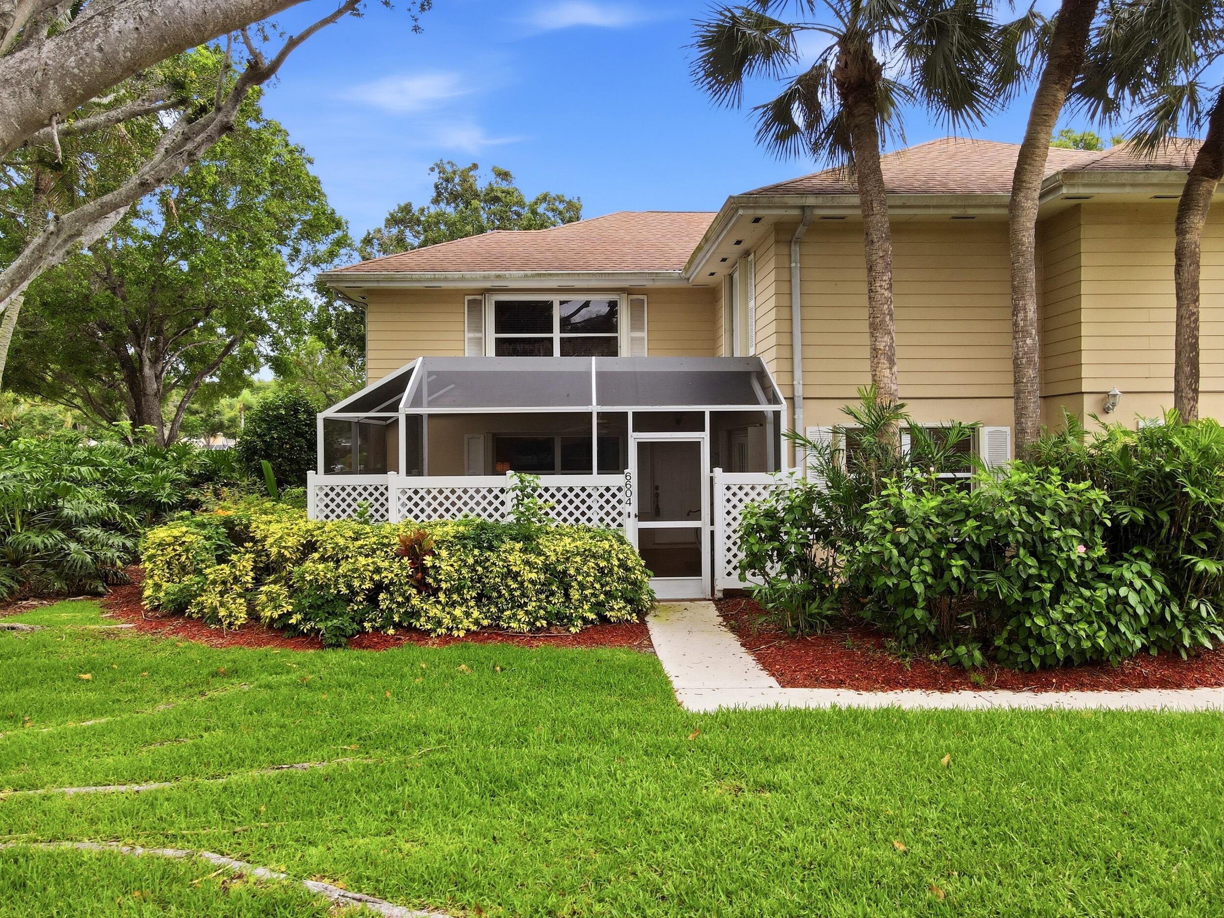 Tucked away in a peaceful, garden-like setting surrounded by mature trees, this charming townhome offers privacy while being just steps from the community pool. The spacious layout features a convenient half bath downstairs and a bright living area that opens to a screened patio and covered lanai, creating the perfect extension of your living space. Upstairs, both generously sized bedrooms feature their own private bathrooms. Located within a gated community, the HOA provides exterior building maintenance and roof replacement, helping keep ownership simple and insurance costs manageable. Conveniently located near shopping, dining, and major highways.