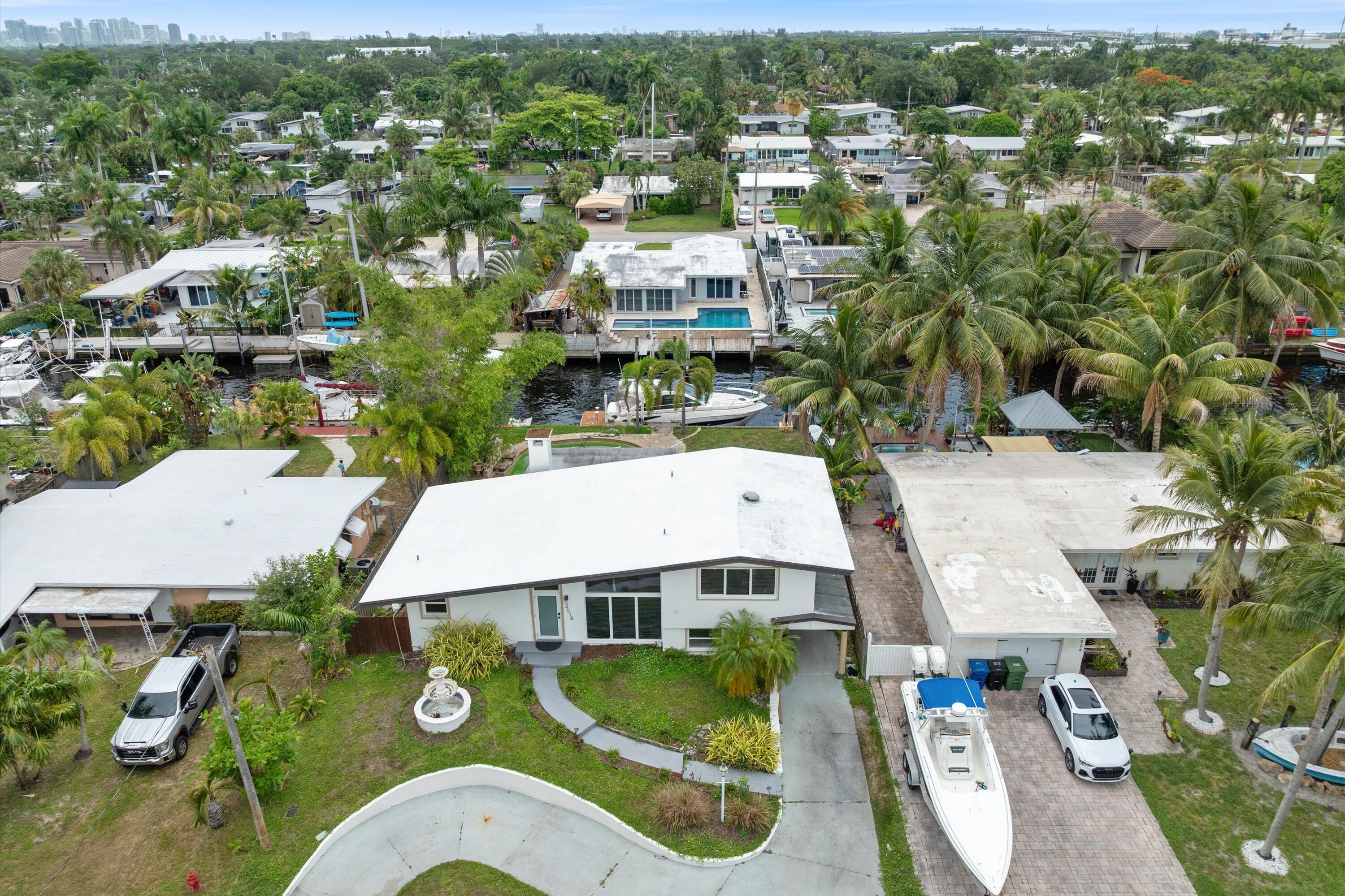 Unfurnished Annual Rental...Completely remodeled waterfront home in desirable Lauderdale Isles offering 65 feet of deepwater frontage with ocean access and no fixed bridges. This exceptional residence features 3 bedrooms, 2 bathrooms, and an ideal split bedroom - open floor plan designed for today's lifestyle. The beautifully updated interior showcases a designer kitchen with quartz countertops, white shaker cabinetry, new appliances, and tastefully renovated bathrooms. The spacious primary suite features a luxurious spa-inspired shower with a rain shower head. Additional upgrades completed between 2023 and 2025 include new flooring, interior doors, and numerous high-quality finishes throughout. Step outside to your private waterfront oasis featuring an expansive terrace, large pool, and  private dock—perfect for boating enthusiasts and effortless indoor/outdoor entertaining. Major improvements include a new roof (2023), water heater (2023), HVAC system (2024), impact windows and doors (2025, excluding two rear sliding glass doors), plus completely renovated kitchen, bathrooms, flooring, and interior doors (2023-2024).