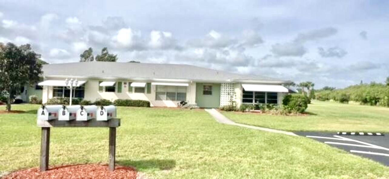 Back on the market! Charming corner unit offers 2 bedrooms and 2 bathrooms in this desirable active adult community close to downtown ft pierce. The full size covered front patio is perfect for relaxing, to the left of it is a wooded area full of trees that gives that fresh breeze perfect on a nice afternoon. Roof was replaced in 2023, toilets and  faucets 2024. Interior Recently painted, baseboards replaced. The back patio gives an uninterrupted view of the lake and the bridge across the street. It also leads to the shared laundry unit. This community has a lot of amenities including a swimming pool, tennis court, gym and shuffleboard. HOA fees include cable, fiber optic internet, water, sewer, trash removal and lawn care.  Your Florida home is waiting. Schedule your private tour!