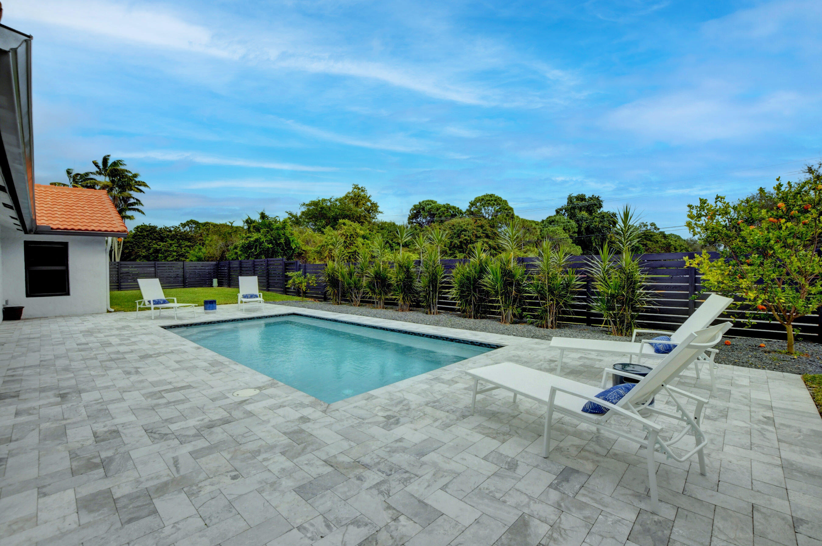 4-bedroom East Boca pool home! Just minutes to the beach, Whole Foods, Boca Mall and Mizner Park. Super private outdoor living at its finest with heated salt water pool, marble pavers and well-manicured, fenced lawn areas on either side of the pool. Available long term, shorter term, furnished or unfurnished. Perfect work from home/corporate relocation setup. Hurricane impact windows and doors. Polished concrete floors and beautifully renovated kitchen and baths. All Pets Welcome!