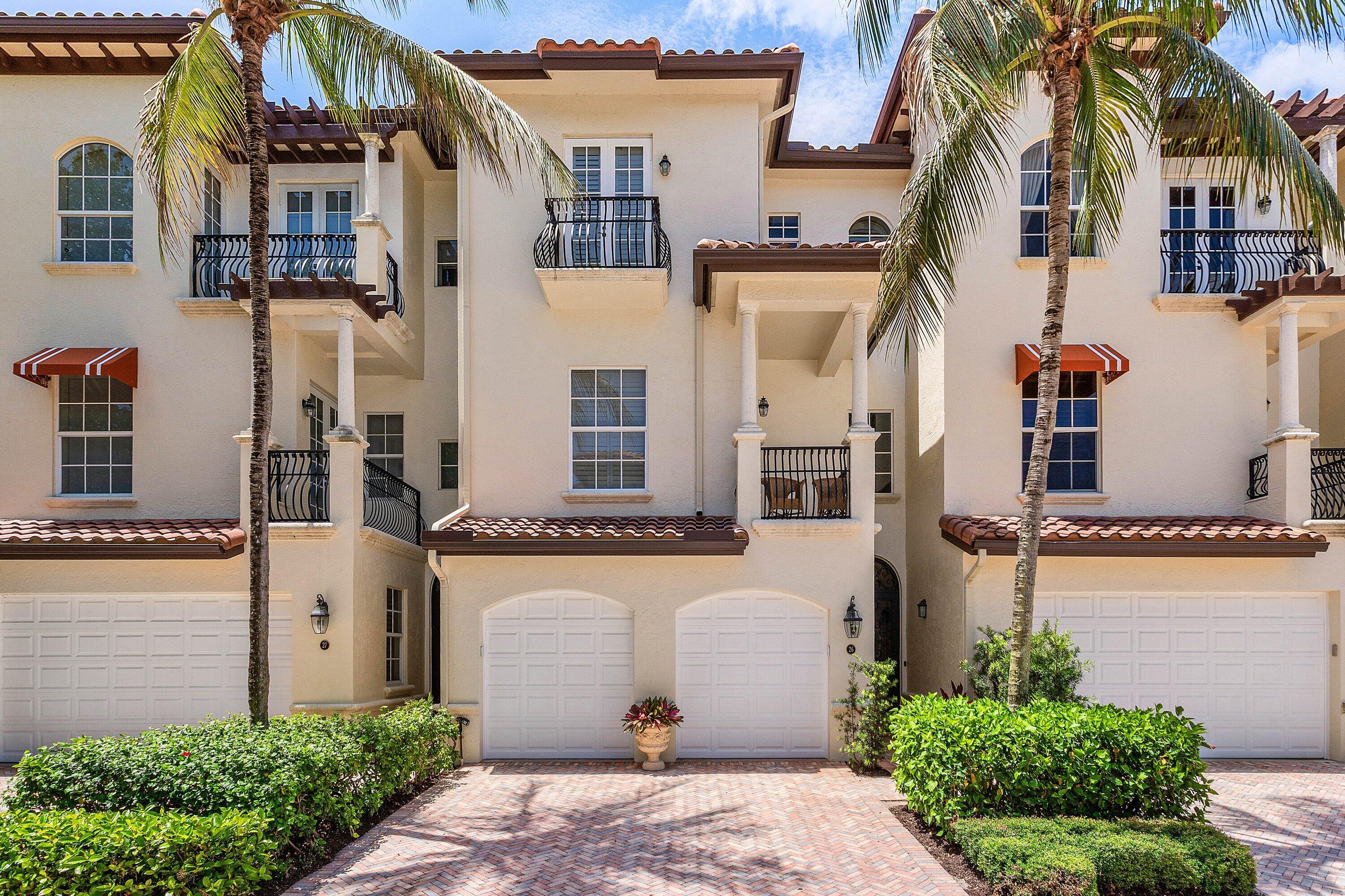 Experience luxury waterfront living in this immaculate three-story townhome located in the prestigious Marina Gardens. Offering 3 bedrooms, 4.5  bathrooms, a 2-car garage, and exceptional custom finishes throughout, this stunning residence combines elegance, comfort, and a coveted boating lifestyle. From the moment you enter, you'll appreciate the meticulous attention to detail, including imported marble and rich hardwood flooring, custom shades and plantation shutters, and exquisite crown molding throughout the home. The first-floor living and entertaining area is designed for effortless indoor-outdoor living, featuring a full bath, spacious laundry room, wet bar complete with wine refrigerator and ice maker, and a large glass elevator providing convenient access to all three levels.  The second floor serves as the heart of the home, showcasing a beautifully appointed eat-in kitchen with custom cabinetry, granite countertops, and a gas range. The adjoining dining area features custom mirrors and designer lighting, creating an elegant atmosphere for gatherings. This level also offers a spacious living area and a generously sized guest suite with a private en-suite bath.  On the third floor, a welcoming foyer and versatile flex space provide the perfect location for a home office, fitness area, or reading retreat. The luxurious primary suite is a true sanctuary, featuring separate his-and-her bathrooms and closets, along with a private balcony overlooking the marina and sparkling waterfront vistas. An additional en-suite guest bedroom completes this level, offering comfort and privacy for guests.  For boating enthusiasts, a deeded 55-foot boat slip in the adjacent marina is available separately for $385,000, providing direct access to some of South Florida's finest waterways and offshore destinations.  This exceptional waterfront residence offers the perfect blend of luxury, convenience, and coastal sophistication in one of Palm Beach County's most desirable marina communities.