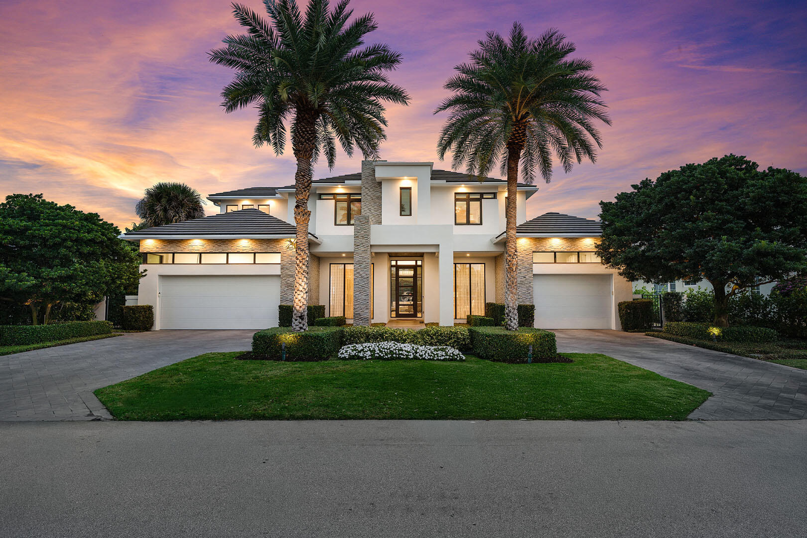 2424 Queen Palm Road is a striking modern estate by River Birch Construction, created for those who value precision, privacy, and effortless luxury. Spanning more than 5,200 square feet, the residence pairs bold architectural lines with warm, refined interiors, anchored by wide-plank oak floors that carry throughout the home.

At the heart of the design, a gourmet kitchen commands attention with a generous center island and premium Miele appliances—equally suited for intimate mornings or elevated entertaining. Nearby, a formal dining space sets the stage for memorable evenings, while a dedicated office and an upstairs loft-style media lounge offer flexibility for work, retreat, and relaxation. The first-floor primary suite is a true sanctuary, thoughtfully positioned with no living space above for an added sense of quiet and exclusivity. Spa-inspired baths, boutique-caliber walk-in closets, an adjacent laundry, and a private entrance from the south garage create a seamless, resort-like experience reserved entirely for the owner.
Outside, the home transforms into a private backyard escape. A custom heated pool and spa invite year-round enjoyment, complemented by a built-in BBQ and a covered patio designed for lingering afternoons, complete with retractable screens and lounge seating for effortless indoor-outdoor living.
Every modern convenience is integrated, from smart home controls for climate, lighting, and music to natural gas, a full generator, impact glass windows and doors, and a pristine turf backyard. With four-bedroom suites and a three-car garage with space for car lifts, the home delivers a rare combination of craftsmanship, comfort, and contemporary sophistication.