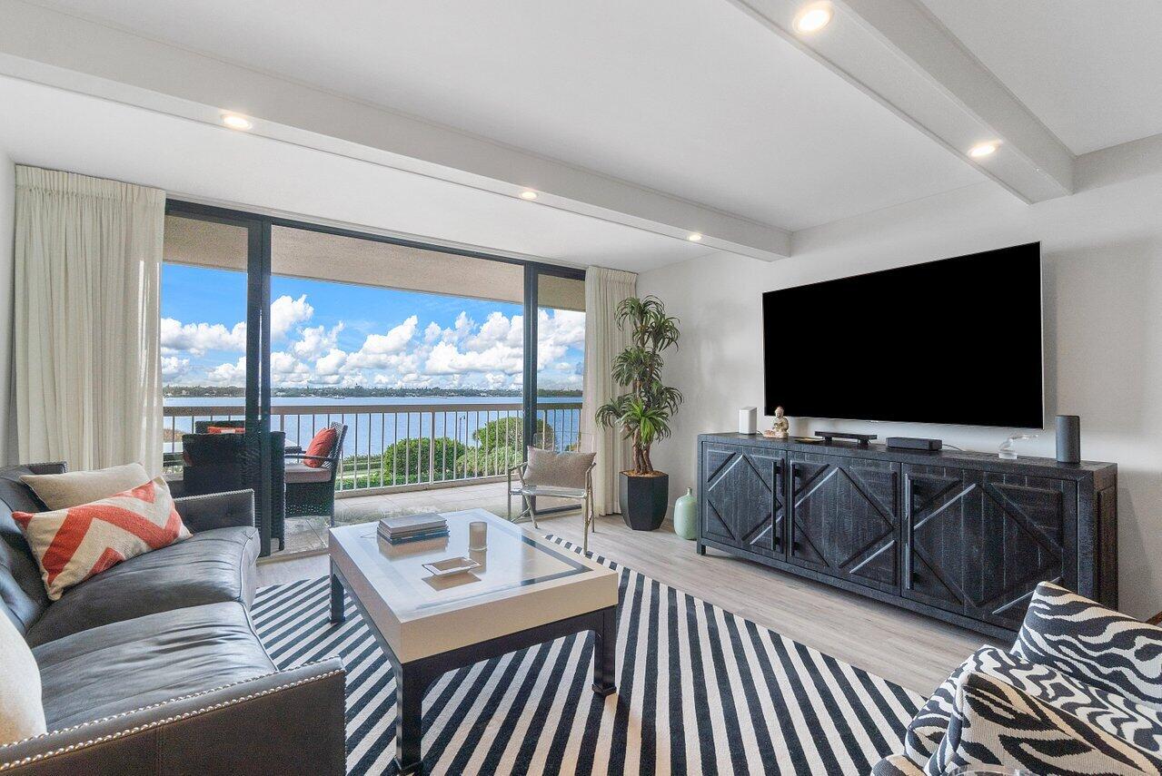 Indulge in panoramic, unobstructed views of the Intracoastal from all main rooms of this oceanfront condominium. Spacious, top floor residence with 2BR/2BA was recently renovated to the highest standards. Includes new lighting, hardware, wide-plank flooring and generous storage. Gourmet, open kitchen features new cabinetry, quartz countertops, and top-grade stainless-steel appliances. Expansive, west-facing balcony provides for sunset entertaining with blissful ocean breezes. Available partly furnished for turnkey access to the Palm Beach lifestyle. Pet-friendly building provides 24-hour doorman, onsite manager, and garage parking. Resort-like amenities include beach access, pool, tennis court, grilling station, gym and spa.