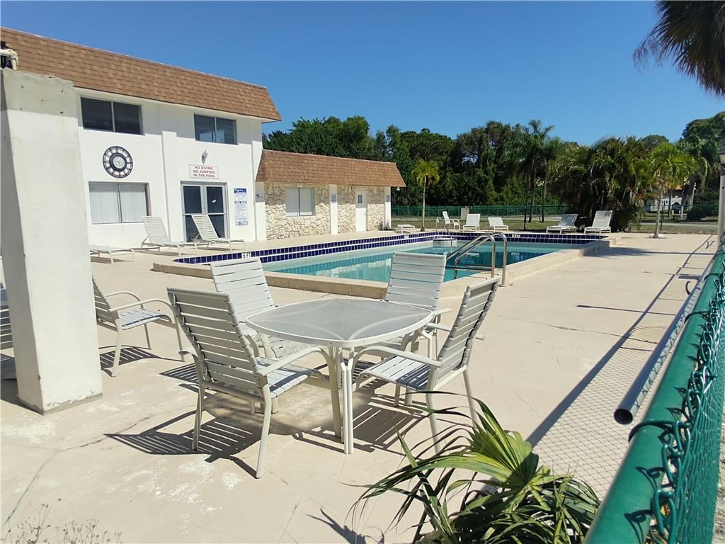 Location, Location, location.....within a mile of I 95, 3miles to the beach, near Palm Beach State Collège, Shopping centers, and JFK Hospital.  A great starter real estate investment (can rent right away).  The screened patio overlooks the water.  Ample Parking.  Great clubhouse with fitness center and pool. Assessment of $115/MO for 7 years.