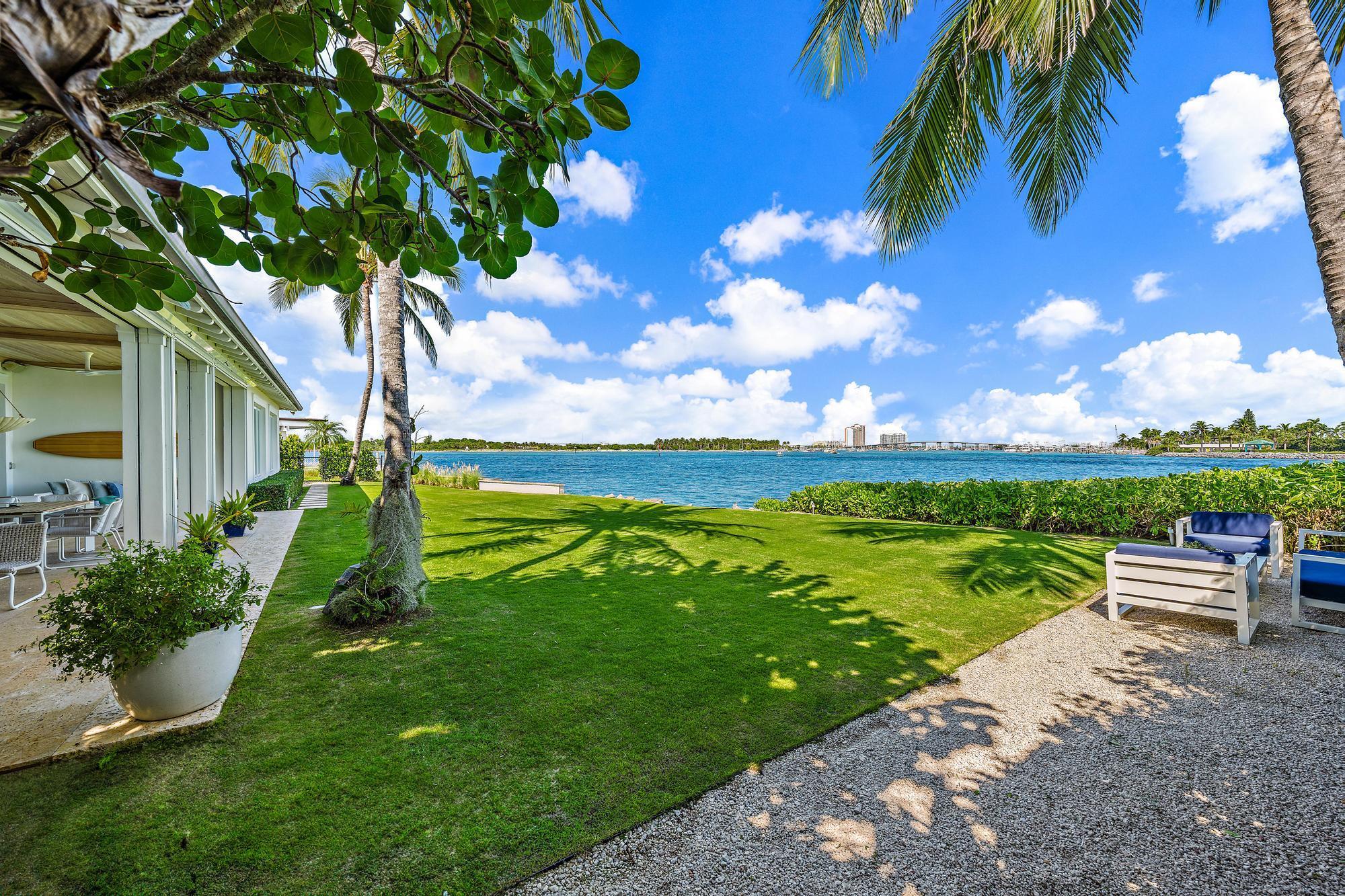 Experience the magic of Palm Beach living at 173 East Inlet Dr., a breathtaking four-bedroom plus a den/fifth bedroom direct waterfront residence that embodies the elegance and perfection of Palm Beach. With one of less than a dozen homes boasting such spectacular views, this property offers a rare chance to embrace the vibrant energy of island life. When this home was designed by highly sought-after local architect Roger Janssen, the sky was the limit and no expense was spared. He collaborated with an acclaimed residential spa creator with luxury 5 star spa experience to bring this residential resort experience to life. You will find stunning and gracious living and entertaining spaces throughout, the kitchen of your dreams, expansive loggia spaces both poolside and oceanside, waterfront primary suite, waterfront den/office, and so much more. The ultimate indoor-outdoor lifestyle features are embodied in this magnificent residence and are what makes Palm Beach life what it is...magic.
This seamless integration of indoor and outdoor spaces are the hallmark of this elegant Palm Beach residence. The expansive living area, perfectly positioned between the ocean and the pool, invites you to relax in style. Step outside to your private pool, where refreshing swims await, or unwind on the spacious covered patio, complete with inviting living and dining areas that showcase spectacular waterfront views. This outdoor oasis is ideal for enjoying leisurely afternoons or hosting delightful gatherings with friends and family.  Living at 173 East Inlet means fully embracing the Palm Beach lifestyle, characterized by elegance and leisure. Spend sun-kissed days at nearby pristine beaches, revel in world-class shopping along Worth Avenue, and indulge in an array of exquisite dining options that cater to every taste. The vibrant local culture, enriched with art galleries and seasonal events, guarantees there's always something new to discover.  More than just a home, 173 East Inlet Dr. is your sanctuary of luxury and tranquility, capturing the essence of refined and elevated living. Do not miss the chance to call this extraordinary property your own and experience the ultimate in Palm Beach perfection.