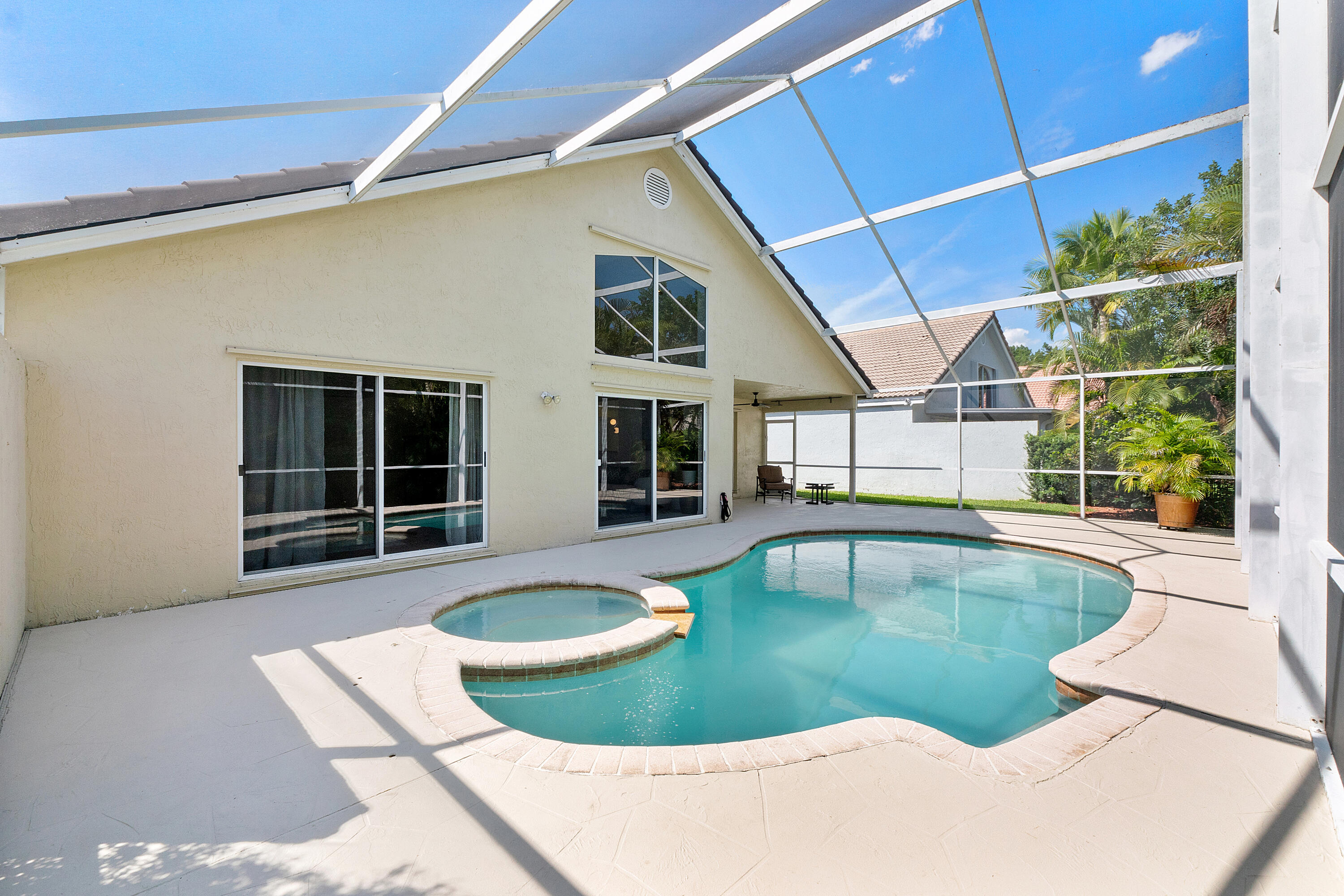 One of a kind Captiva Cay lushly landscaped 100% HOA all-inclusive professionally maintained oasis with total privacy in this 3/2, 2324 total sq. ft. single-story home tucked away within a cul-de-sac in a gated community. Ideally situated in the heart of Weston and within walking distance to Weston Town Center, this 2026 freshly renovated home offers both convenience and lifestyle. Newly replaced tiled roof & 2026 renovated kitchen are just some of the highlights of this clean, pristine gem. Spacious layout provides soaring vaulted ceilings & abundant natural light complemented by tiled flooring & elegant lighting fixtures. Property enveloped by lush landscaping on a sweet tree-lined street ending in a cul-de-sac for exclusivity and privacy.  Primary bedroom generously sized, w/hardwood flooring & open concept design seamlessly flowing into living areas. Enjoy access to highly A+ rated schools and retreat to your own private backyard oasis, complete with an oversized vaulted screened in private patio, heated pool and jacuzzi inviting indoor/outdoor living! Coupled with interior vaulted ceilings & bright, light-filled rooms create warm & welcoming atmosphere. Come! See! Own!