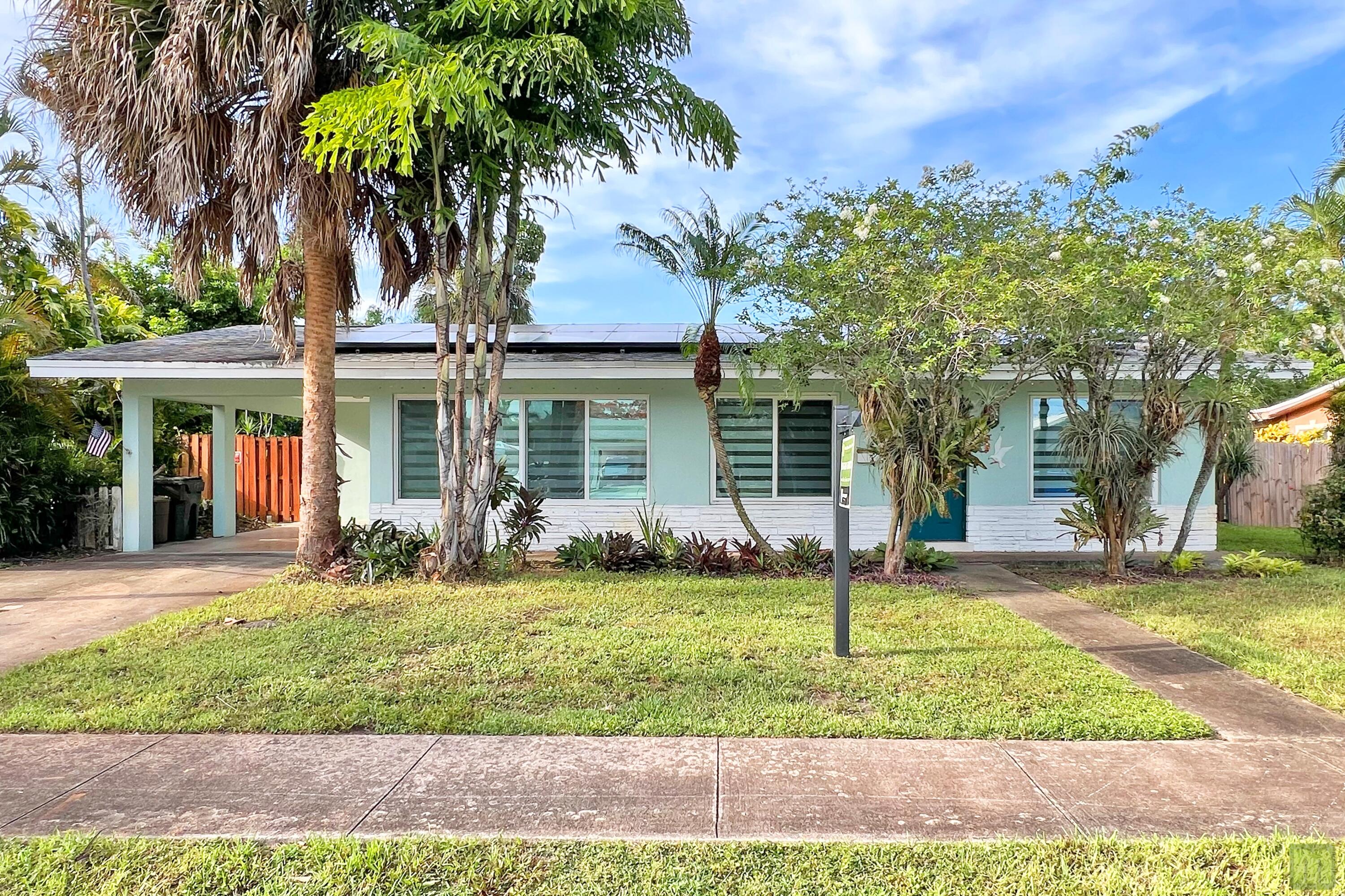 NEW $50k SOLAR included, that's right!  Enjoy a super low electric bill in this beautifully updated home in South Coconut Creek. 3 roomy bedrooms & 2 bathrooms with a private primary en-suite. The kitchen is the heart of any home and it shows with clean white shaker cabinetry, stainless steel appliances, quartz countertops & peninsula seating. Stylish wood-look tile flooring, modern bathrooms featuring glass shower enclosures, & designer tiles. Modern motorized blinds adorn large windows that flood the space with natural light.  2016 Roof, 2021 A/C, 2024 water heater, updated electrical & more! Enjoy Florida living in a beautiful in-ground pool, covered patio & roomy, fenced yard.  yes, you can have it all - and NO HOA!!! Close to schools, shopping, turnpike & just 7 miles to the beach.