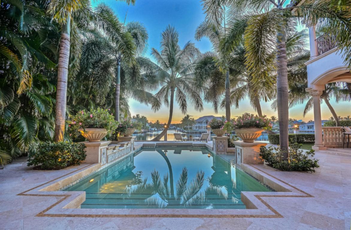 ALMOST ONE HALF ACRE - DEEDED PRIVATE OCEAN ACCESS.EXTRAORDINARY PROFESSIONALLY FURNISHED & DECORATED INTRACOASTAL GATED RESIDENCE ON S OCEAN BLVD. UNOBSTRUCTED WATER VIEWS. 4BR, 6.2 BATHS,LIBRARY, WINE, GRAND MEDIA & BILLARD'S ROOMS. RARE PROTECTED 22x60 YACHT BASIN ON NORTH SIDE. TWO STORY FOYER SHOWCASES ELABORATE CEILINGS/LIVING RM W/STONE FIREPLACE; REPLICA VANDERBILT BILTMORE ESTATE CHANDELIER. CHEF'S KITCHEN INCLUDES MAPLE CABINETRY,PREPARATION ISLAND, BREAKFAST BAR, BUTLER'S PANTRY AND HIGH END APPLIANCES. 2ND STORY GRAND MASTER SUITE WITH ICW BALCONY; SEPARATE HIS/HER'S BATHROOMS W/CUSTOM BUILT-INS. 3 ADDITIONAL 2ND STORY BEDROOM SUITES- TUSCAN INSPIRED-VENETIAN PLASTER - GUEST BALCONY OVERLOOKING POOL PATIO. STUNNING COVERED POOL PATIO ENTERTAINMENT/BBQ AREA. 24 HOUR NOTICE. ELEVATOR AND 4 CAR GARAGE.