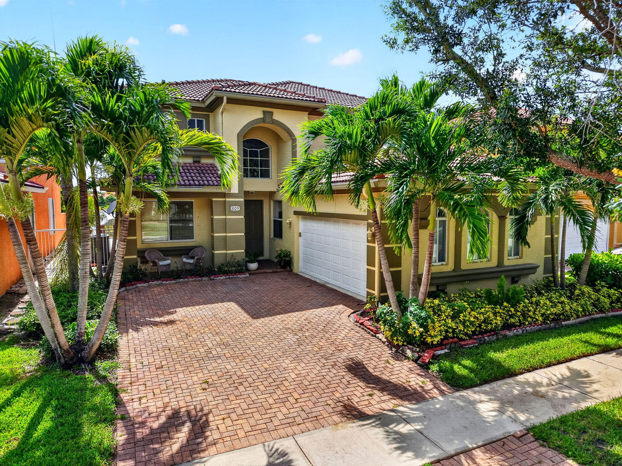 Experience comfortable lakefront living in this spacious two-story home located in a beautifully maintained, 24-hour manned gated community. Enjoy peaceful lake views and an exceptional lifestyle with community amenities that include a clubhouse, resort-style pool, fitness center, tennis and basketball courts, playgrounds, and scenic walking paths.  Inside, the thoughtfully designed floor plan offers a desirable first-floor bedroom with a full bathroom, ideal for guests, extended family, or a private home office. The bright, open kitchen features stainless steel appliances, a center island, ample cabinet space, and a breakfast area that flows seamlessly into the family room, creating the perfect space for everyday living and entertaining. Upstairs, the spacious primary suite overlooks the lake and includes dual walk-in closets and a spa-inspired bathroom with dual vanities, a soaking tub, and a separate shower. Two additional bedrooms, a generous loft that can easily be converted into a fifth bedroom, and another full bathroom complete the second floor.  Additional highlights include tile flooring throughout the main level, laminate flooring upstairs,  a dedicated laundry room, and abundant natural light throughout. Conveniently located near top-rated schools, shopping, dining, parks, and major highways, this lakefront home offers the perfect blend of space, comfort, and community living.  *All information is deemed reliable but not guaranteed. Buyers are responsible for independently verifying all information, including but not limited to measurements, dimensions, HOA fees, rules and regulations, and property details.*