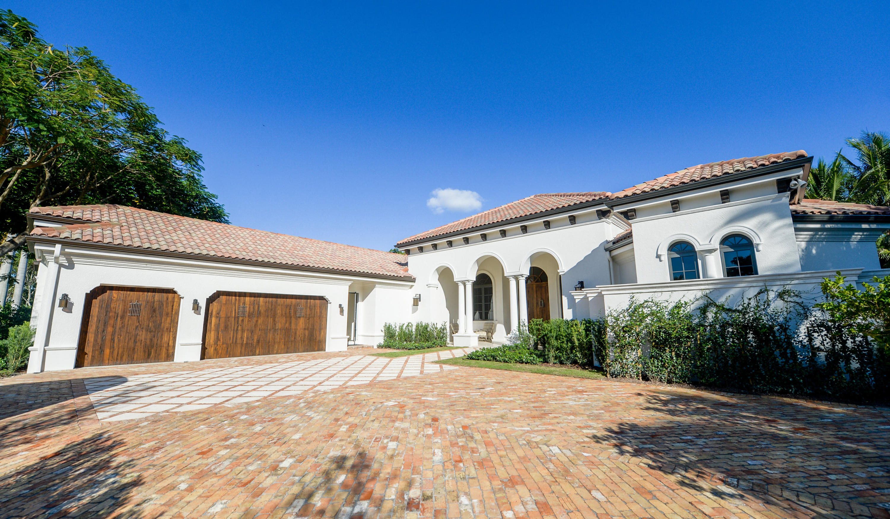 Location location location. Equestrian Club Estate home newly renovated with impact glass and solid mahogany entry doors. This spacious 4 bedroom/5 full bath/2 half bath home offers luxurious living for all. Relax by the sparkling new pool surrounded by Bermuda grass and a fully equipped summer kitchen. All of this, just steps from the horse show. There is not a finer luxury home for the discerning equestrian, desiring space, privacy, and security!