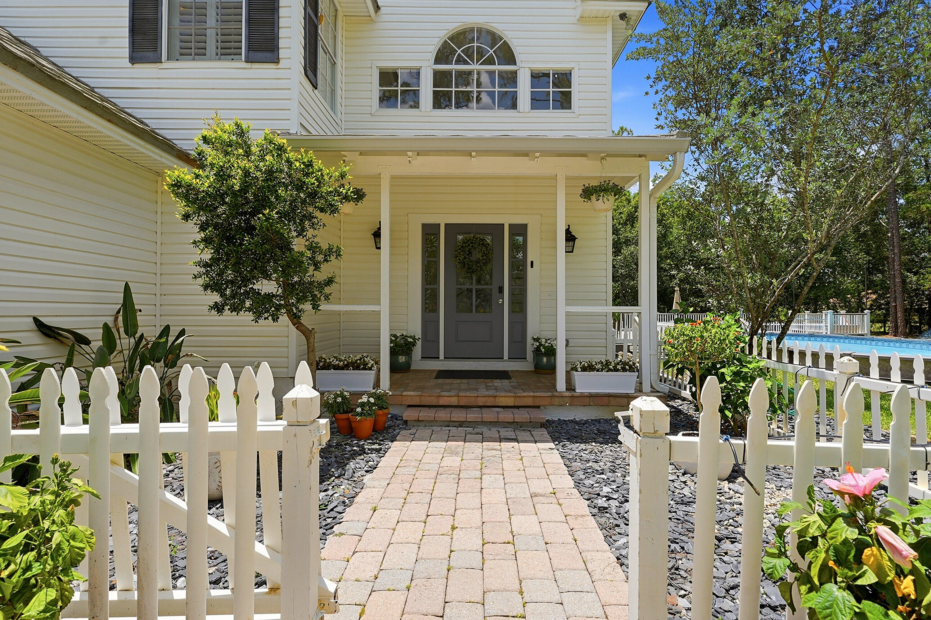 Move right into this beautifully updated 4-bedroom, 2.5-bath pool home featuring a spacious three-car garage and set on 1.15 fully fenced acres. Offering the perfect blend of privacy, space, and modern convenience, this property provides the freedom of no HOA living while remaining just minutes from shopping, dining, and everyday amenities.  Inside, you'll find refinished hardwood floors, new engineered hardwood flooring throughout the second level, fresh interior paint, updated lighting and hardware, new baseboards, a new kitchen sink, and the removal of all popcorn ceilings, creating a bright, clean, and truly move-in-ready home.  Step outside to your private backyard retreat, complete with a sparkling pool and an expansive outdoor entertaining deck—perfect for dining al fresco. Recent Improvements & Updates ·       Brand-new well water filtration system  ·       Refinished hardwood floors on first floor  ·       New engineered hardwood flooring on second floor  ·       Fresh interior paint throughout entire home  ·       All popcorn ceilings removed  ·       New light fixtures throughout  ·       New baseboards throughout  ·       New kitchen sink with new hardware  ·       New washer and dryer  ·       New pool cartridge filter  ·       New outdoor dryer  ·       Additional refrigerator in second garage  ·       New House Survey