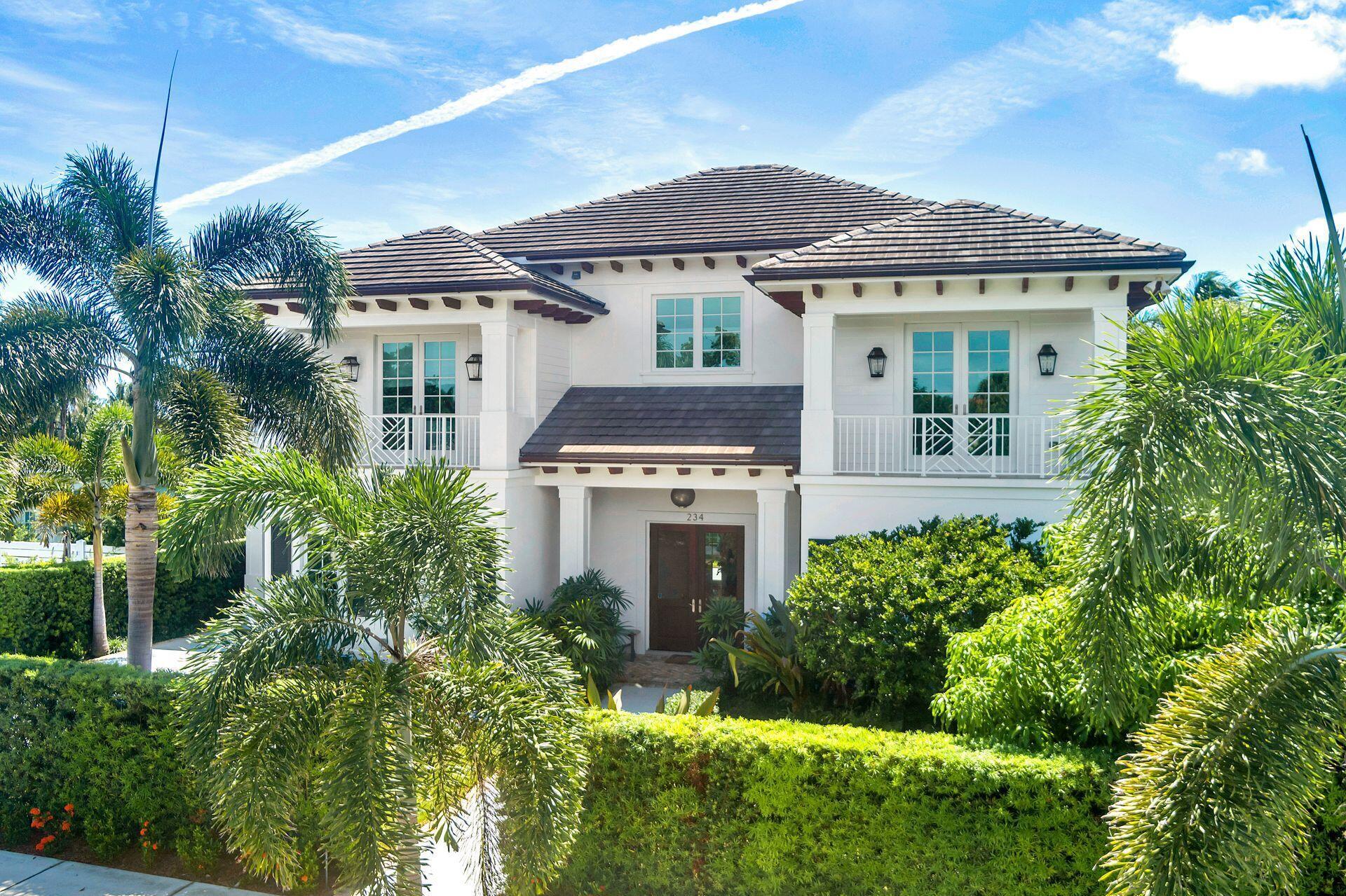 Nestled in West Palm Beach's prestigious South End, ''So So'' neighborhood, located one block from the Intracoastal. this home features 4 bedrooms, 4 baths, 2 half baths in the main house plus a 1BR/1BTH + den guest cottage. This well appointed compound merges modern sophistication in construction with architecturally centered serenity. The thoughtful design originates at the entry and extends through the 'spine' of the home to the gardens, uniting bright and airy interiors with 10+ foot ceilings to lush and private grounds, impeccably landscaped with mature tropical plants providing the utmost privacy. The first floor centralizes the living space around the modern chef's kitchen with gas cooktop, high-end appliances, centered island, abundant cabinetry and a walk-in butler's pantry. The formal dining space is adorned with a handcrafted Moroccan chandelier and opens to the kitchen with a bay-window breakfast nook. The dramatic and inviting living room is surrounded by French doors overlooking the pool and gardens. The first floor also boasts a den, a powder room and a large bedroom/office with an ensuite bath and a spacious walk-in closet. A custom stairwell opens to the upstairs sitting room/loft area. The entry room to the primary can be used as an office or sitting room and opens to a large enclosed balcony overlooking the backyard vista and is positioned to bring in the rejuvenating sunrise and gulfstream breezes. The primary bedroom itself is expansive featuring a trayed ceiling, north, south and east facing windows, and two large walk-in closets out fitted with custom built-ins. The primary bathroom is very luxurious boasting separate vanities, a large shower and soaking tub. There are 2 additional large bedrooms upstairs, each with ensuite baths, walk-in closets and private balconies. There is an upstairs laundry room for the utmost convenience, plus one downstairs and one in the cabana bath by the pool.

The south facing backyard features a rap around porch, including  a 65-foot breezeway connecting the garage and guest quarters. Perfect for entertaining with TV, summer kitchen and cabana bath all overlooking the large teak decked heated pool. The second story guest cottage has its own entrance with a living room, kitchenette, bedroom plus den all finished to a standard similar to the main house. The property also boasts an entirely separate rear entrance to the oversized climate controlled 2-car garage and the upstairs guest quarters. Impeccably built, solid wood doors, high-end craftsmanship, incredible lighting and fixtures throughout, all hurricane impact windows and doors. 

The consciousness in every step of the home imbues an intangible gain of lifestyle as the home is more than the sum of its parts for a serene take on the West Palm Beach lifestyle. Minutes away from all the West Palm Beach lifestyle has to offer. Close proximity to Palm Beach Island, Antique Row, CityPlace, and Palm Beach International Airport.

Total living square footage including guest cottage is 5,467 SF and totals to 5 bedrooms, 5 baths and 2 half baths. Price per square foot for total living square footage is $1,005.12/SF.