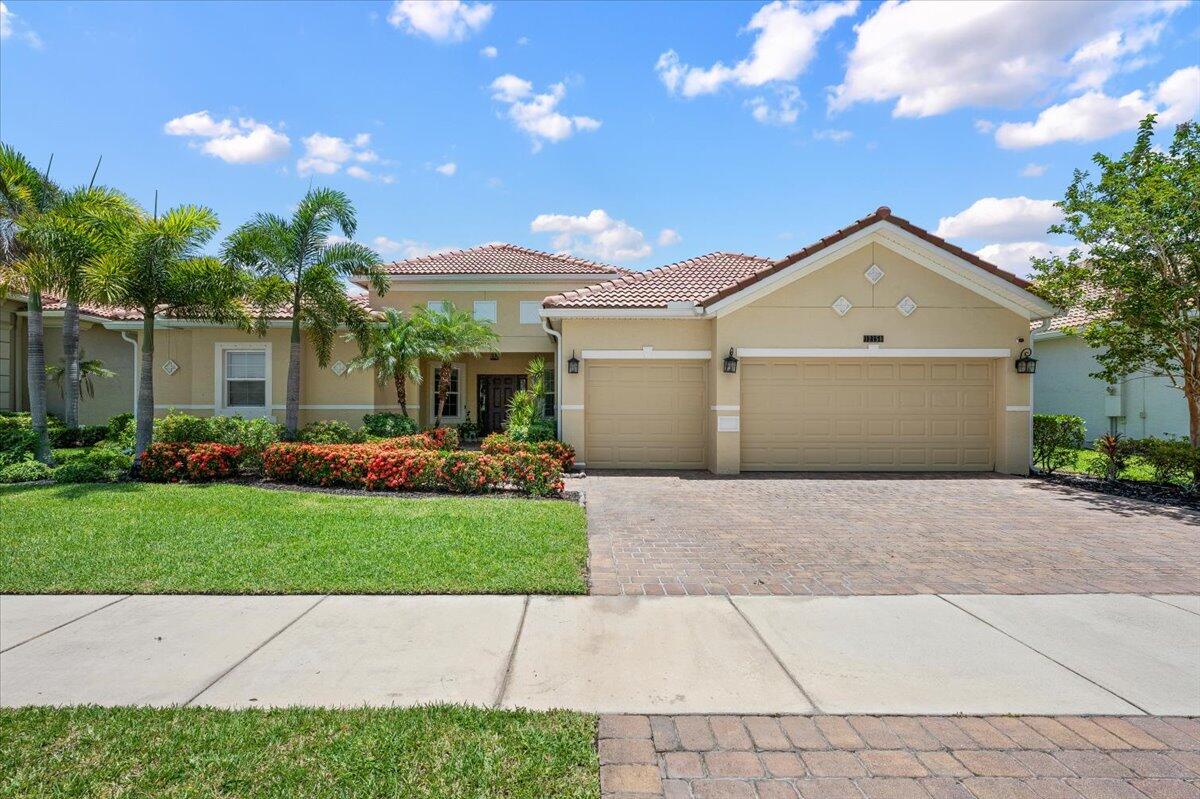 RARE FIND! Stunning single-story home with over 3,400 sq. ft. overlooking the lake. Featuring 4 spacious bedrooms, 3 full baths, office, and a 3-car garage, this home is designed for both comfortable everyday living and unforgettable entertaining. Nestled in a gated community with a community pool, you'll love the convenience of being just minutes from Tradition's vibrant shopping, dining, entertainment, and healthcare destinations. A rare combination of size, location, and lifestyle!
