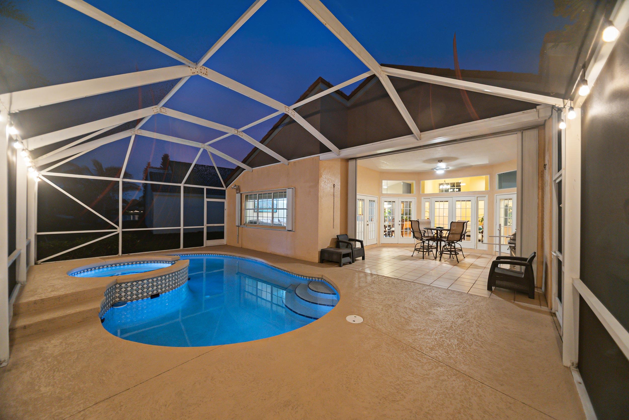 Rare opportunity in highly sought-after Lakes Community in Weston! This 4BR/2.5BA single-story home sits on a quiet private street with premium water and park views. Features include laminate flooring throughout, a spacious layout, and a boarded attic for added storage. Enjoy a screened-in pool and spa with LED lighting, perfectly positioned for ideal sun exposure. Full hurricane protection with accordion shutters throughout. Two-car garage plus ample guest parking. Guard-gated community with soccer field, pool, and playground. Walk to shopping, dining, and daily conveniences. Homes like this don't last—schedule your showing today!
