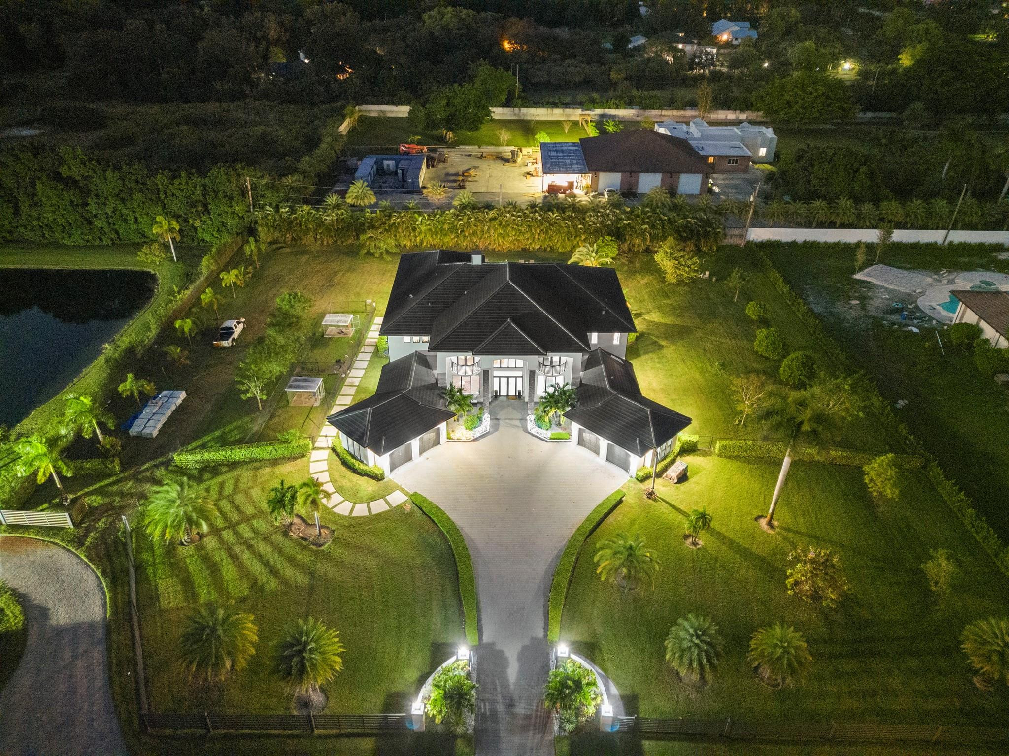 ***NEWLY BUILT IN 2021,THIS MODERN CONTEMPORARY ESTATE IS LOCATED IN THE HEART OF SUNSHINE RANCHES!!!***BOLD AND STATELY ON NEARLY 2 ACRES,THIS SECLUDED ENCLAVE OF ONLY 3 HOMES IS TUCKED AWAY & HIDDEN W/I PLAIN SITE. TOTALING 10,695 SF,MAIN LIVING AREA 7,560 SF,OFFERS 6 BEDRMS+OFFICE,7.5 BATHS,W/4 CAR GARAGE. CONTROL 4 SMART HOME W/ACCESS FROM YOUR PHONE. TWO-STORY TRIPLE SPLIT FLR PLAN W/IMPRESSIVE RMS SIZES &THREE BONUS RMS FOR THE FULL FAMILY EXPERIENCE. DESIGNER MODERN KITCHEN W/ S/S STEEL APPLIANCE PACKAGE,WALK-IN PANTRY,EXTRA CABINETS,QUARTZ COUNTERS. GRAND FOYER ENTRY W/SOARING 24' COFFER &DECORATIVE CEILINGS,CROWN MOLDING,ACCENT LIGHTING,LED LIGHTS THRU-OUT. 4’X2' MARBLE FLING IN SOCIAL AREAS &WOOD FLRS IN ALL BEDRMS. RESORT STYLE 40’X40’ HEATED, SALT POOL W/JACUZZI &TANNING SHELF.