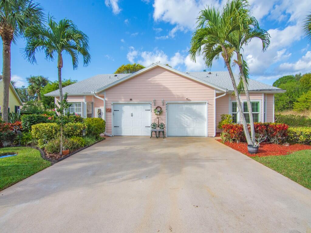 Located on the 5th tee at Gator Trace CC, this beautiful villa has an air conditioned porch making it 1700 sq ft of living space.  As the end unit, a more private location on a cul de sac offers additional space for guest to park. There is IMPACT glass throughout except for the porch, newer roof ( maintained by the HOA) , vinyl plank flooring throughout, recently painted interior, granite counters, NEW AC Sept 2025, NEW Water Heater Nov 2025, new disposal, new dishwasher 2026, and granite counters in the kitchen which offers a pass through to the dining area.  Gator Trace CC is a semi-private club where you can enjoy golf as a member or pay daily fees. The massive club pool is available to all owners and the clubhouse restaurant is open to the public.