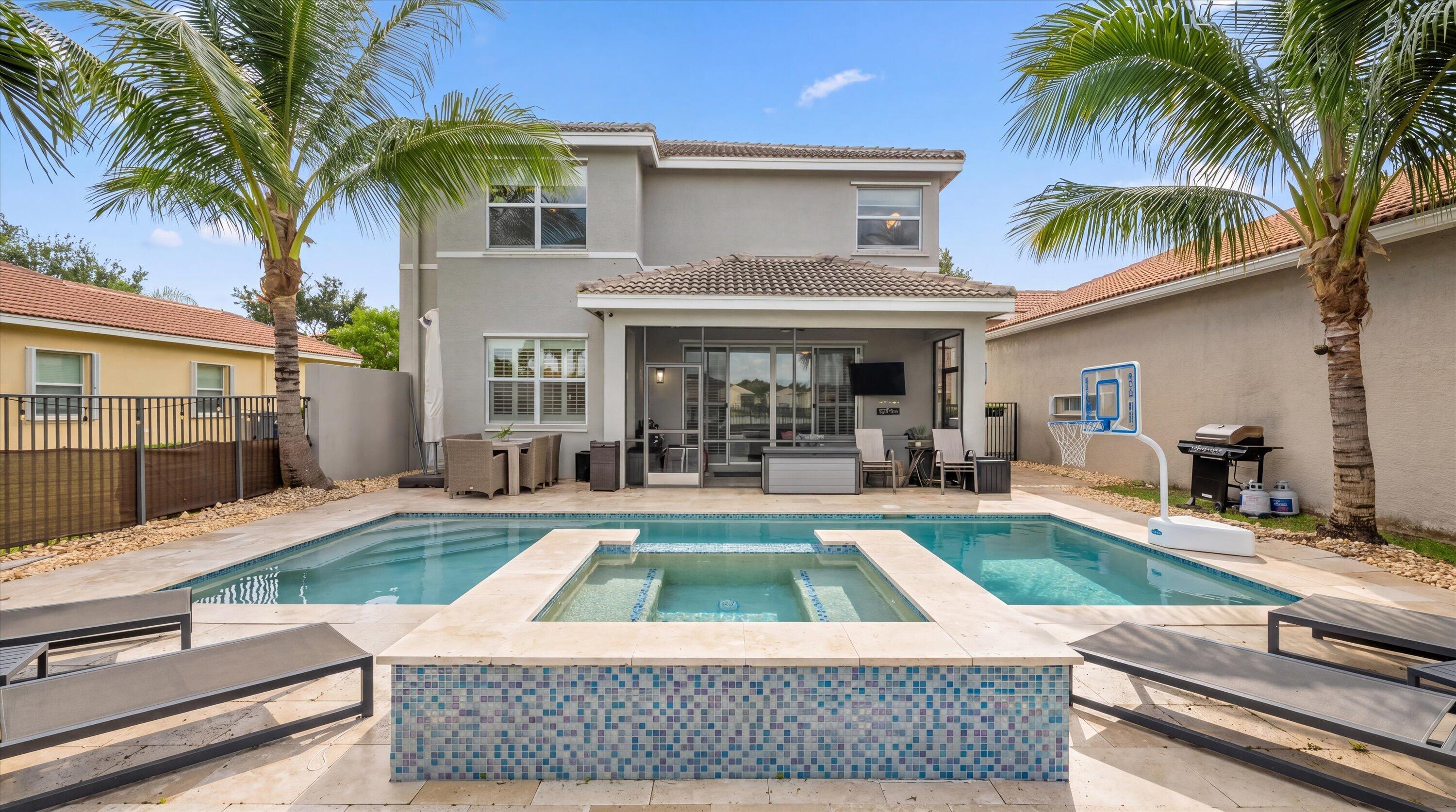 Welcome to this well maintained 5-bedroom, 4-bath lakefront pool home offering South Florida living at its finest with breathtaking sunset views. Located within the highly desirable gated community of Canyon Springs zoned for A-rated schools, this wonderful residence features a spacious split floor plan with generously sized bedrooms, a loft, and a spacious primary suite designed for comfort and privacy. The large eat-in kitchen is equipped with stainless steel appliances, granite countertops, and opens seamlessly to the family room, dining room, and  main living area—perfect for both everyday living and entertaining. Step outside to your private backyard featuring a saltwater heated pool with spa, an expansive pool deck, and a screened-in patio complete with TV setup,  all overlooking tranquil lake views and protected green space for added privacy. Additional highlights include a two-car garage and a prime location just moments from shopping, grocery stores, restaurants, and Delray Marketplace, where you'll enjoy convenient access to movies, bowling, dining, and entertainment. Residents also enjoy resort-style amenities including a glamorous clubhouse, fitness center, tennis, pickleball, water park, kids' play areas, resort-style pool, and much more.