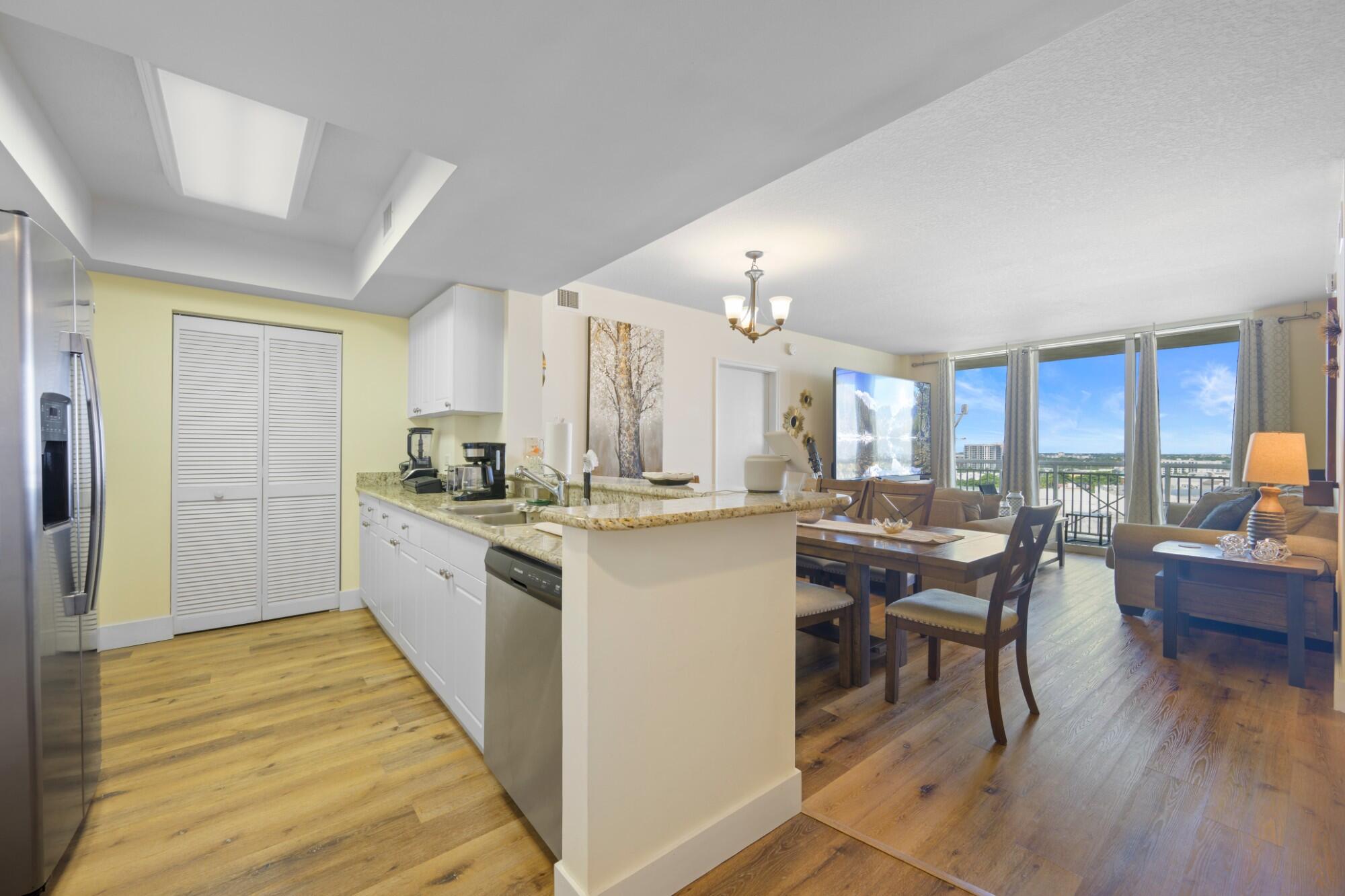 Updated 2BR/2BA residence with a desirable split floor plan at Turnberry on the Green. High-floor unit with open west-facing city and sunset views, private balcony, and wood-look flooring throughout living areas and bedrooms. Kitchen features granite countertops, white cabinetry, stainless steel appliances, breakfast bar, and full-size washer/dryer. Spacious primary suite with walk-in closet and en-suite bath. Impact windows and sliding glass doors. Located across from Aventura Mall and next to the Turnberry Golf Course walking trail, minutes from beaches, dining, Gulfstream Park, and major highways. Building amenities include 24-hour lobby, valet, pools, fitness center, sauna, BBQ area, playground, dog park, and assigned covered