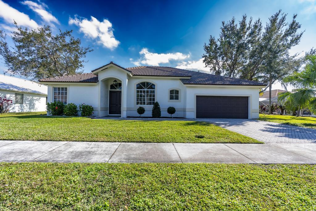 SELLER FINANCING OR LEASE OPTION AVAILABLE! Stunning Lakeview Pool Home in Heatherwood - Fully Remodeled and NEW Roof! Nestled in the gated community of Heatherwood, this beautiful 4-bedroom, 2.5-bath home offers breathtaking lake views and a newly resurfaced pool with a brand-new pump, motor, and screens. Step inside to soaring 14' ceilings and an open, airy layout with tile throughout. The brand-new kitchen is a showstopper, featuring quartz waterfall countertops, white soft-close cabinets, a stylish tiled backsplash, and newer Samsung stainless steel appliances. Fresh interior and exterior paint add to the home's modern appeal. Enjoy cable and internet included with the HOA and the serenity of this sought-after community. Don't miss your chance to own this waterfront gem!