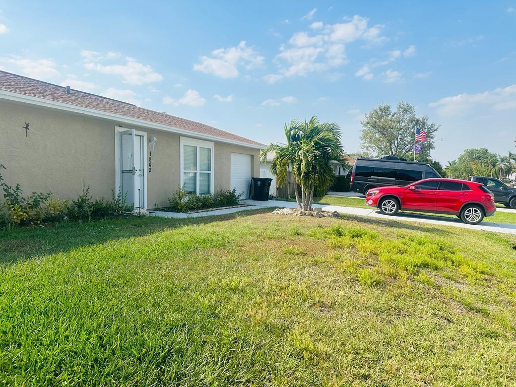 Beautiful 2 bedroom, 2 bathroom single-family home located in the heart of Port Saint Lucie. This residence features a well-designed vinyl flooring layout and a kitchen equipped with essential appliances, including a refrigerator, range, microwave, and dishwasher, all complemented by wooden cabinets. Spacious master bed & bathroom with a combined tub and shower. Enjoy a bright and airy living area ideal for relaxing or entertaining. Conveniently situated just minutes from major highways, supermarkets, shopping centers, restaurants, and more!!!