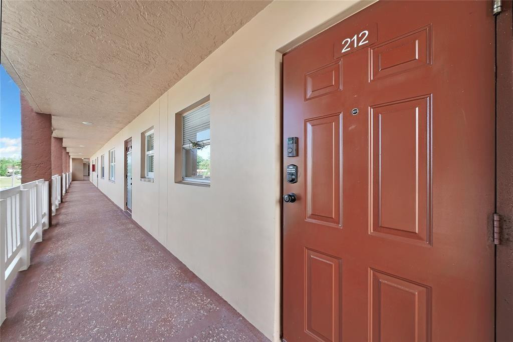 WOW look no further! Beautiful corner unit featuring a serene water view and a fully enclosed patio, perfect for relaxing year-round. This home offers a remodeled kitchen and bathrooms, stainless steel appliances, and newer flooring throughout. Enjoy modern touches including no popcorn ceilings and custom blinds that provide exceptional privacy. Meticulously maintained. WOW look no further! Beautiful corner unit featuring a serene water view and a fully enclosed patio, perfect for relaxing year-round. This home offers a remodeled kitchen and bathrooms, stainless steel appliances, and newer flooring throughout. Enjoy modern touches including no popcorn ceilings and custom blinds that provide exceptional privacy. Meticulously maintained.