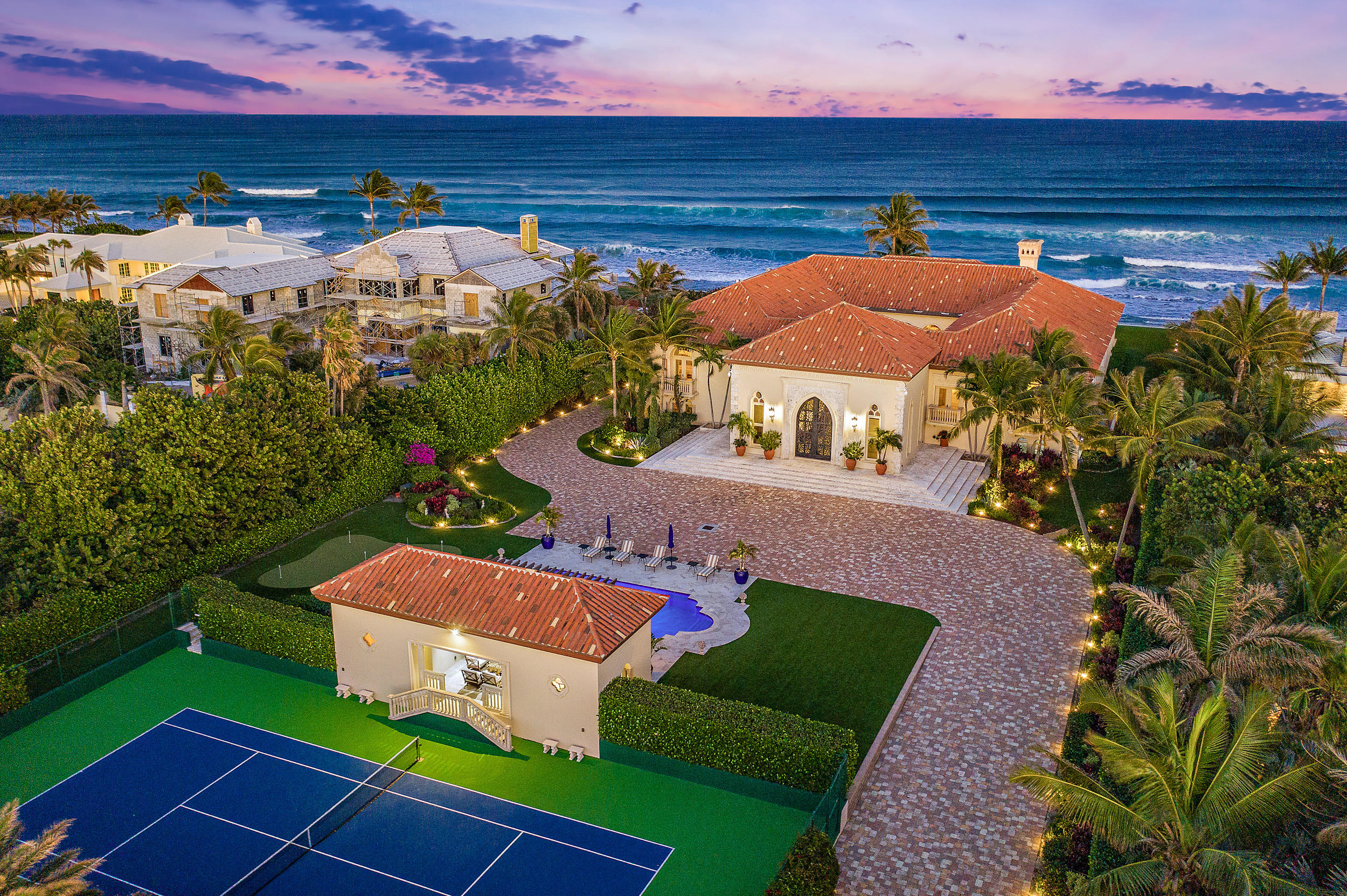 Available just in time for the 2021 season with renovations to be completed soon, this exquisite Ocean-to-Intracoastal custom estate is situated on 1.7 acres in Manalapan, with both 160 feet of direct oceanfront and 160 feet of intracoastal waterway with a private dock and two lifts. This coastal masterpiece is the epitome of traditional elegance fused with contemporary luxury, and was built with the 2021lifestyle in mind. Recent upscale additions, including a brand new, state-of-the-art home gym and spa, have increased the under air square footage to over 20,000 square feet and over 26,000 total square feet of magnificent, private space. The entire 1.7 acre property is perfectly appointed to entertain effortlessly and live in ultimate luxury, boasting 7 bedrooms, [CLICK TO CONTINUE] 9 full bathrooms and 2 half bathrooms, a home office, home theater/board room, a large 2-bedroom full guest apartment, 10+ car garage, gourmet kitchen, full-sized tennis & sport court, sparkling pool, cabana, summer kitchen, and putting green. 

The information herein is deemed reliable and subject to errors, omissions, or changes without notice. Buyer should verify all measurements and information. 

The Property:
Enter your breathtaking residence through the gated, private entrance to find a long stone driveway leading to the home's impressive exterior, upscale lush landscaping, a sprawling, immaculate turf lawn, and a fabulous pool & cabana  all spectacularly designed to make you feel like you've arrived at your own exclusive resort. 

The Residence:
The palatial iron front doors open to a dramatic sweeping staircase and soaring cathedral ceilings which set the stage for the grandeur of the estate. Continue into the elegant atrium to be dazzled by the courtyard fountain and impeccable indoor outdoor flow as you make your way into the grand oceanfront room. Feel inspired by the sensational pecky cypress ceilings, a 25-foot illuminated onyx full bar, and wood-burning fireplace as you are captivated by the incredible views of the ocean. The exquisite wood and stone work and the finest custom finishes throughout continue to maintain the elegance of the residence as you make your way from one space to the next. The gourmet chef's kitchen and butler's pantry perfectly compliment the oceanfront dining room and breakfast room. 1160 South Ocean provides all the luxuries you didn't even know you needed. The 10+ car garage with service restroom, the newly installed state-of-the-art home gym with infrared sauna and steam room, the elevator, the guest suite & media room with projector and 130 inch retractable screen, and the guest living room with kitchen are all designed to create an unmatchable luxury experience. Added conveniences include concrete block construction (CBS), hurricane impact glass, Icynene insulation, 10 AC systems each with Reme Halo, HEPA filters, dehumidifiers, and UV lights. 

The Lifestyle:
Everyday at this one-of-a-kind property will feel like a day at the finest resort with endless opportunities to enjoy the incredible South Florida weather and lifestyle. Start the day with a cup of coffee on your private beachfront as you watch the sunrise over the ocean with gorgeous sea breezes. Head to the tennis court for a morning game with friends before you hit the ocean for an afternoon on the boat. Steps across Ocean Boulevard is the private dock you've been dreaming about with not one, but TWO lifts -- one lift for a 24,000 lb boat and the other for 50,000 lbs. No need to store your yacht anywhere but at your own backyard dock situated directly on the intracoastal waterway. Once you arrive back at the residence, take a dip in your sparking swimming pool, relax by the cabana and complete the afternoon with a few swings on the putting green. With its unbeatable location featuring access to both the ocean and the intracoastal and with incredible amenities on-site, this magnificent estate is a rarity on the market offering the complete South Florida lifestyle experience.

In addition to the unparalleled luxuries at the estate, residents of Manalapan benefit from deeded privileges at the Five-Diamond Eau Palm Beach Resort & Spa and its La Coquille Club.